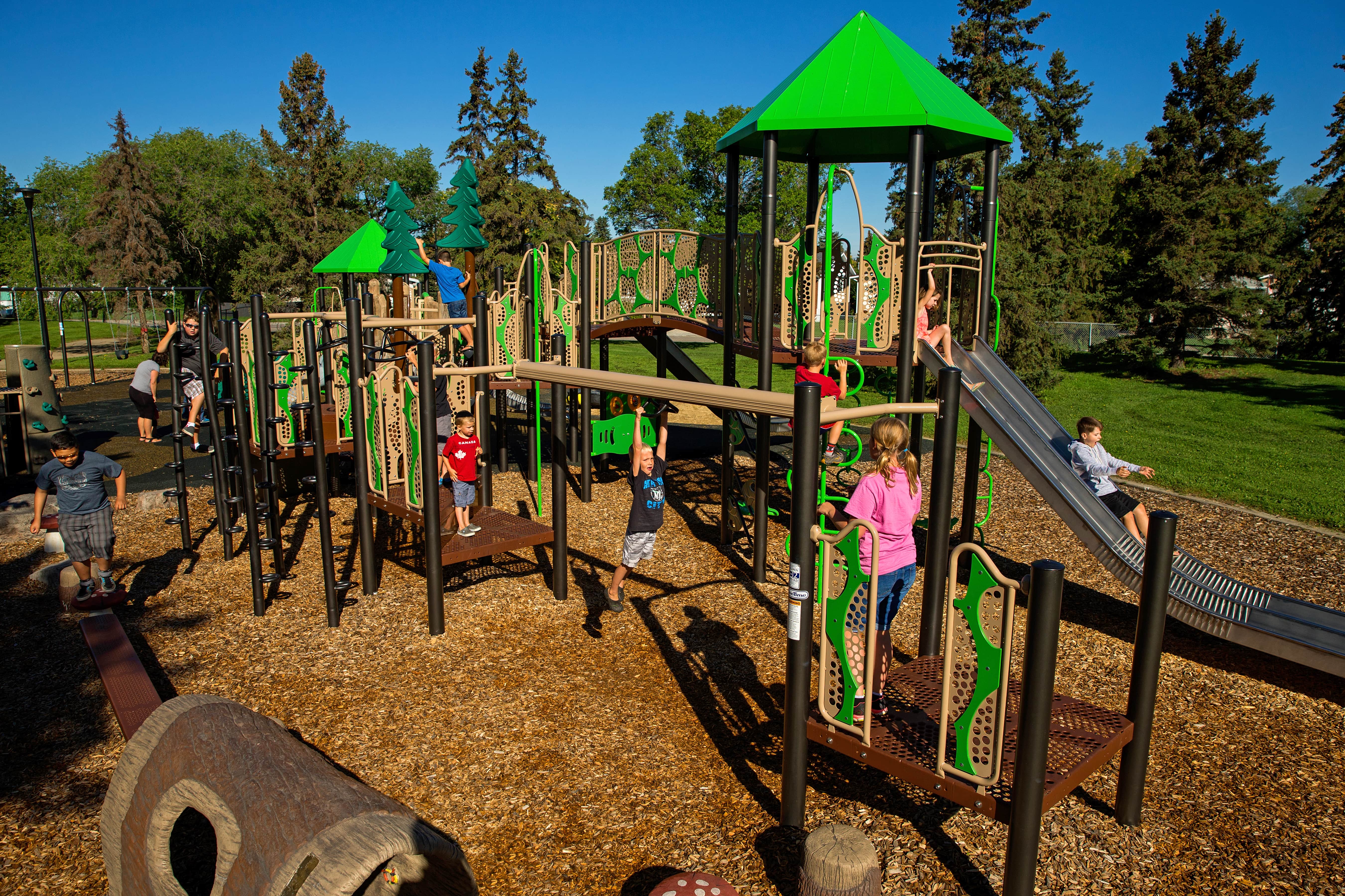 Lendrum "Honey Bee" Themed Park playground equipment in Edmonton, AB with custom bee hive structures