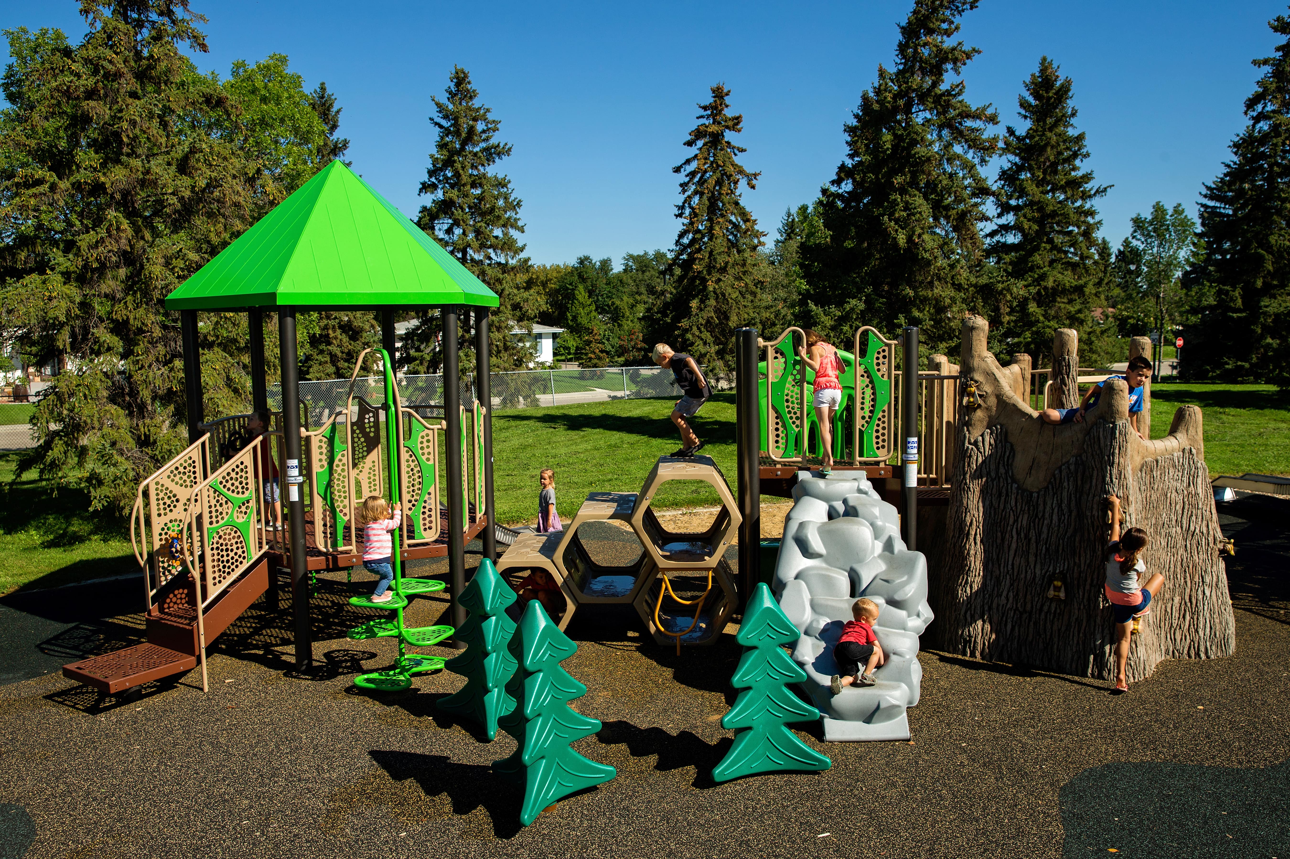 Lendrum "Honey Bee" Themed Park playground equipment in Edmonton, AB featuring fitness equipment stations