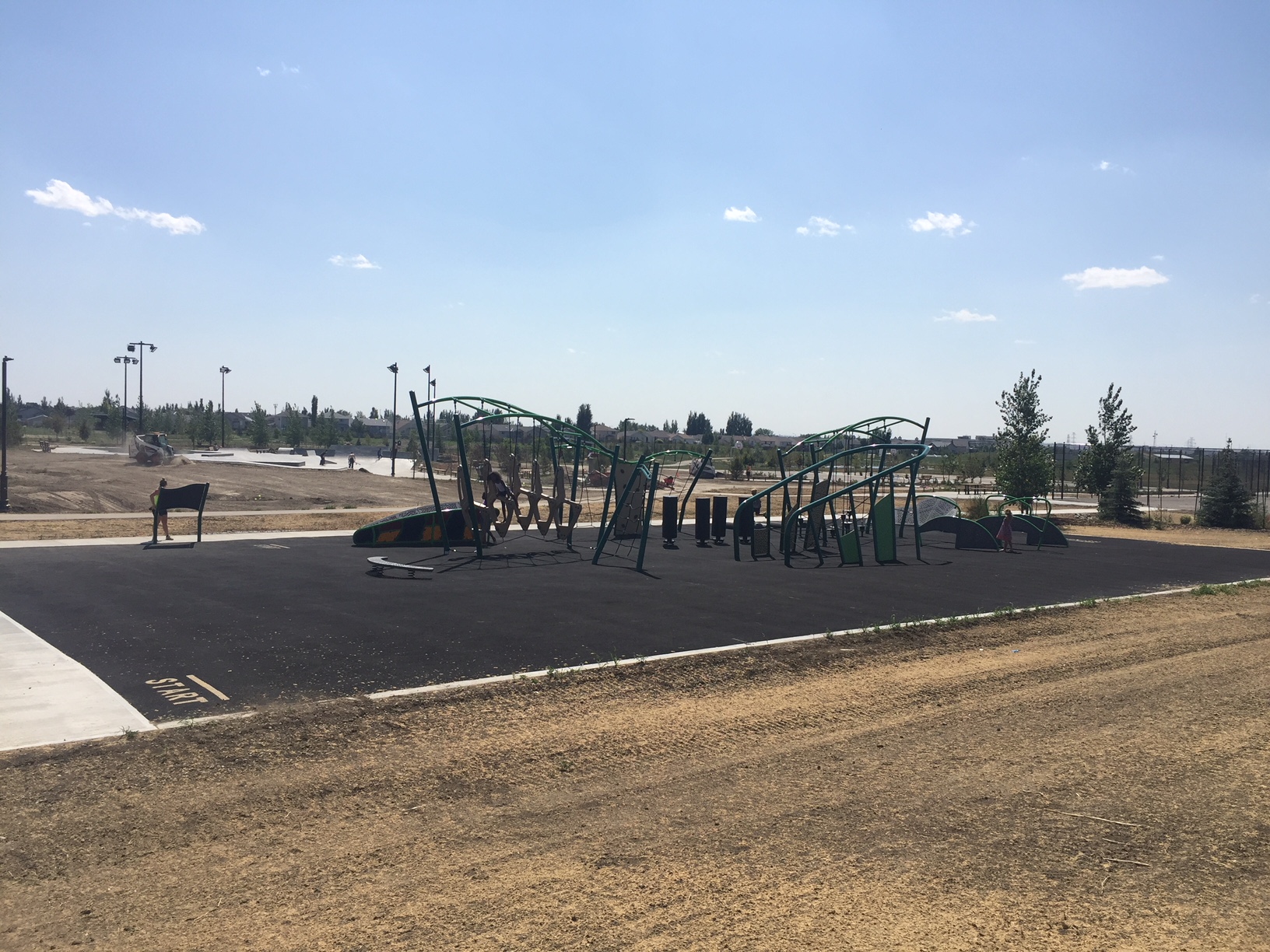 Legacy Park Challenge Course playground equipment in Lethbridge, AB with climbing and sliding features