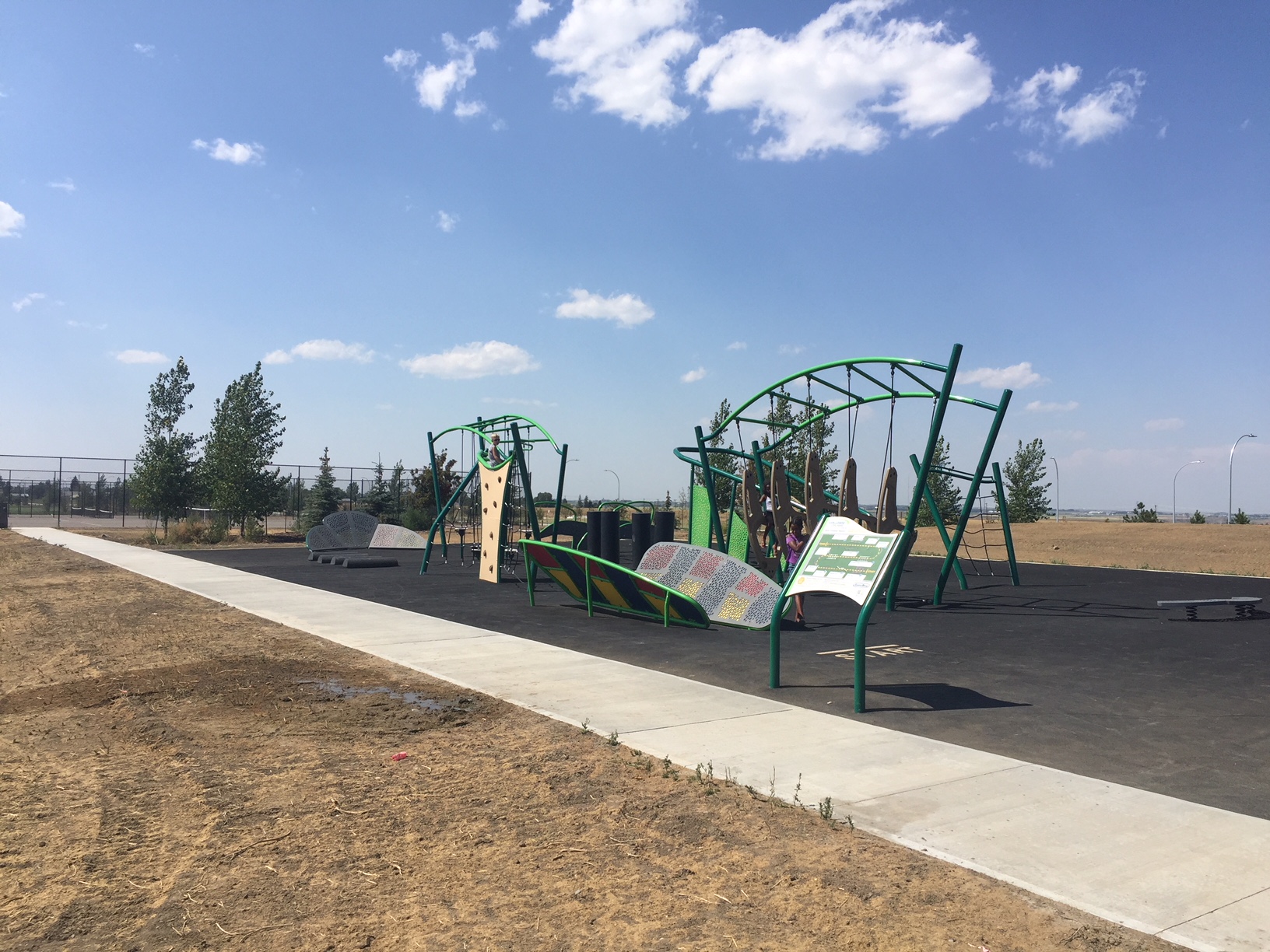 Legacy Park Challenge Course playground equipment in Lethbridge, AB featuring colorful play structures