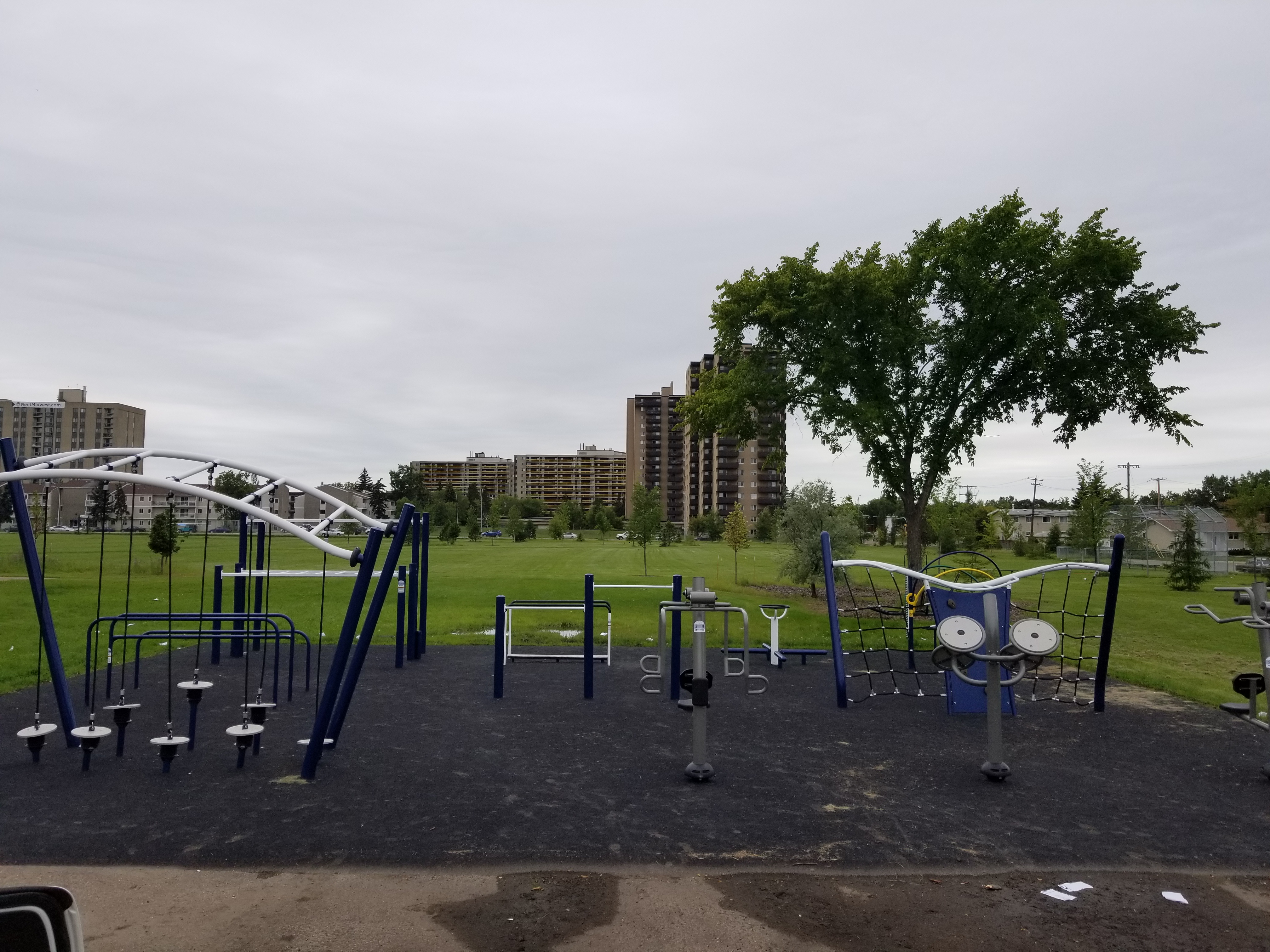 L.Y. Cairns School Playground playground equipment in Edmonton, AB featuring colorful play structures