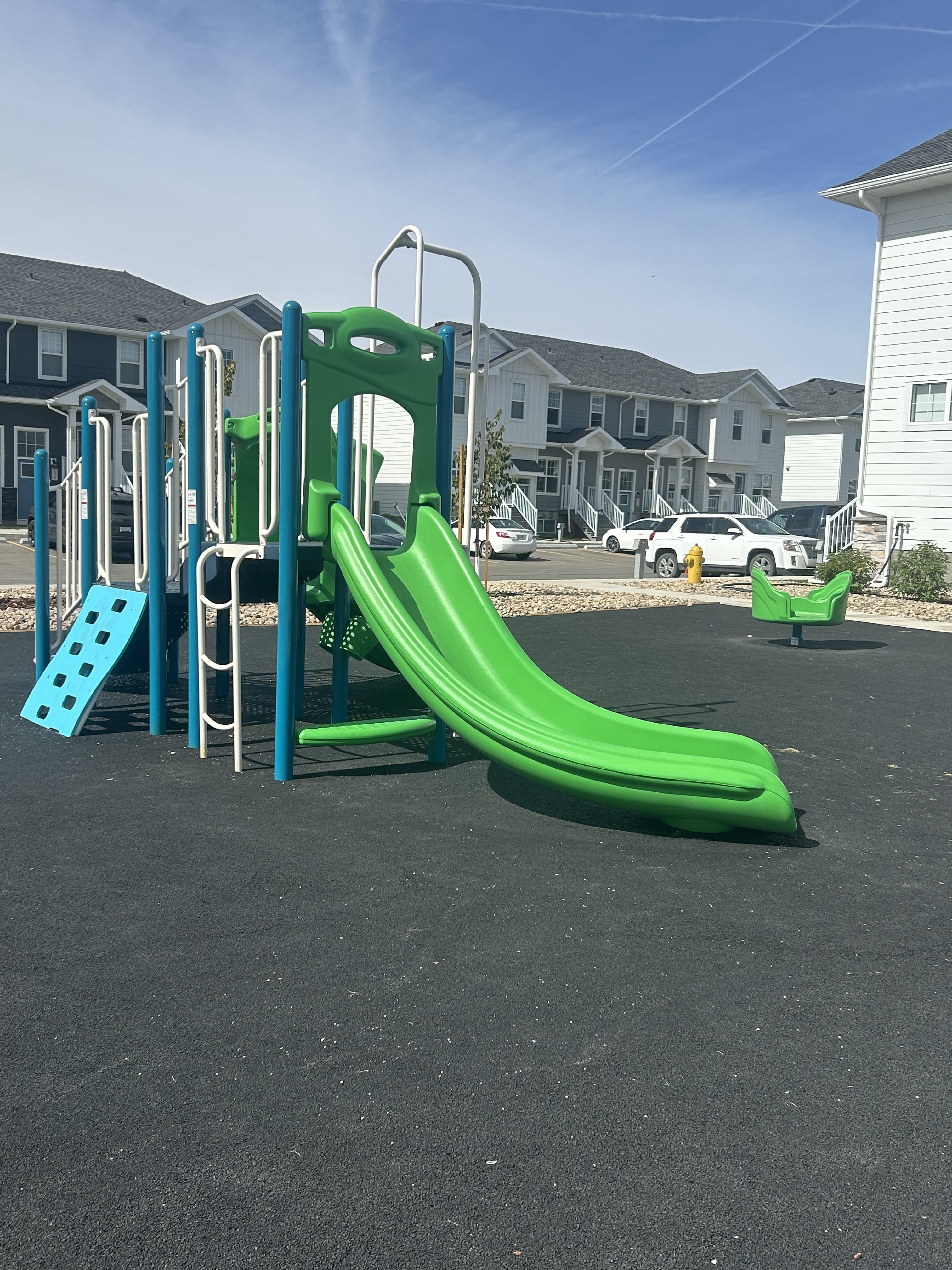 Windsor Park playground equipment in Regina, SK featuring colorful play structures