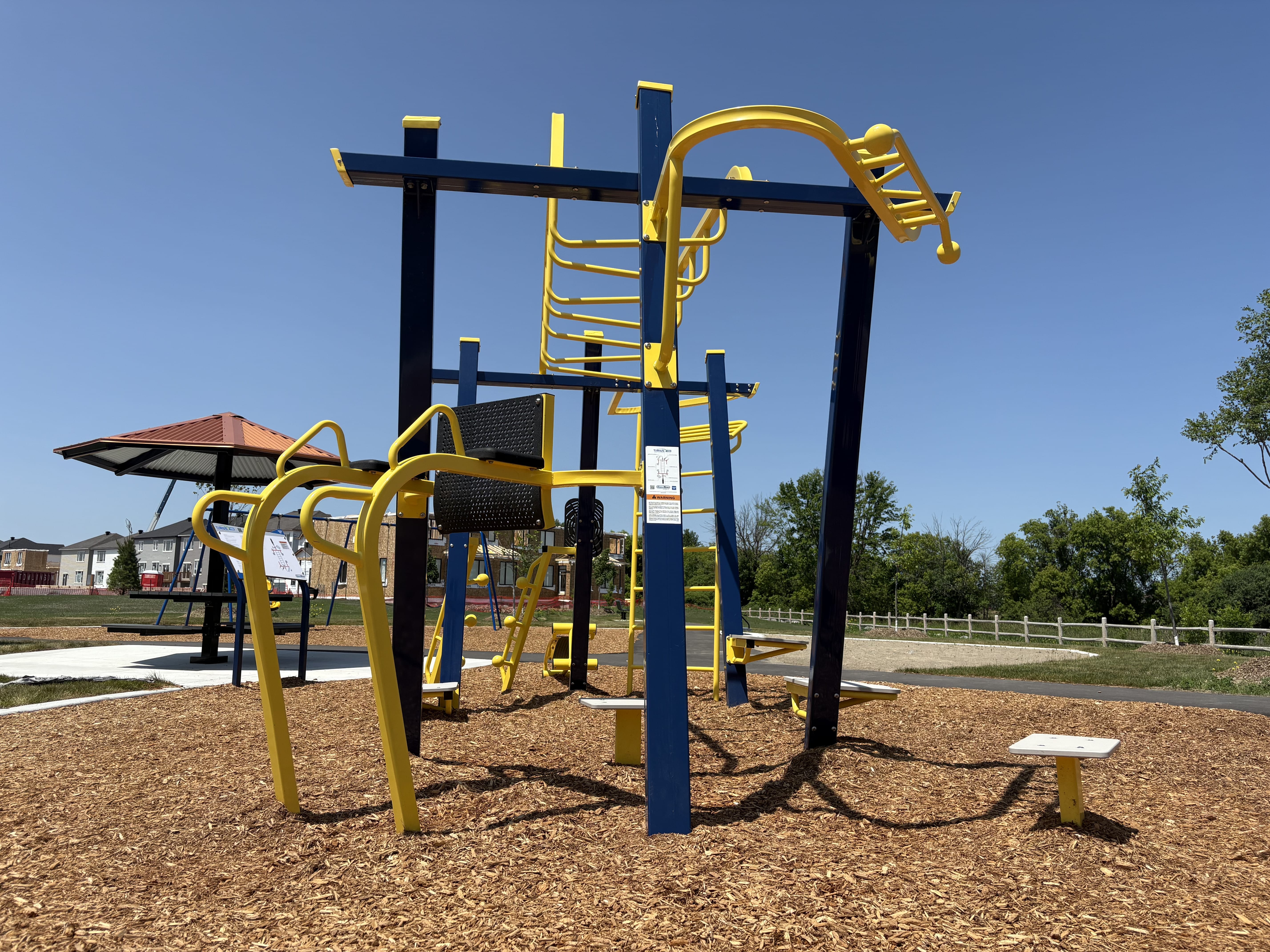 Canoe Park Thrive 450 playground equipment in Ottawa, ON with natural and built play elements