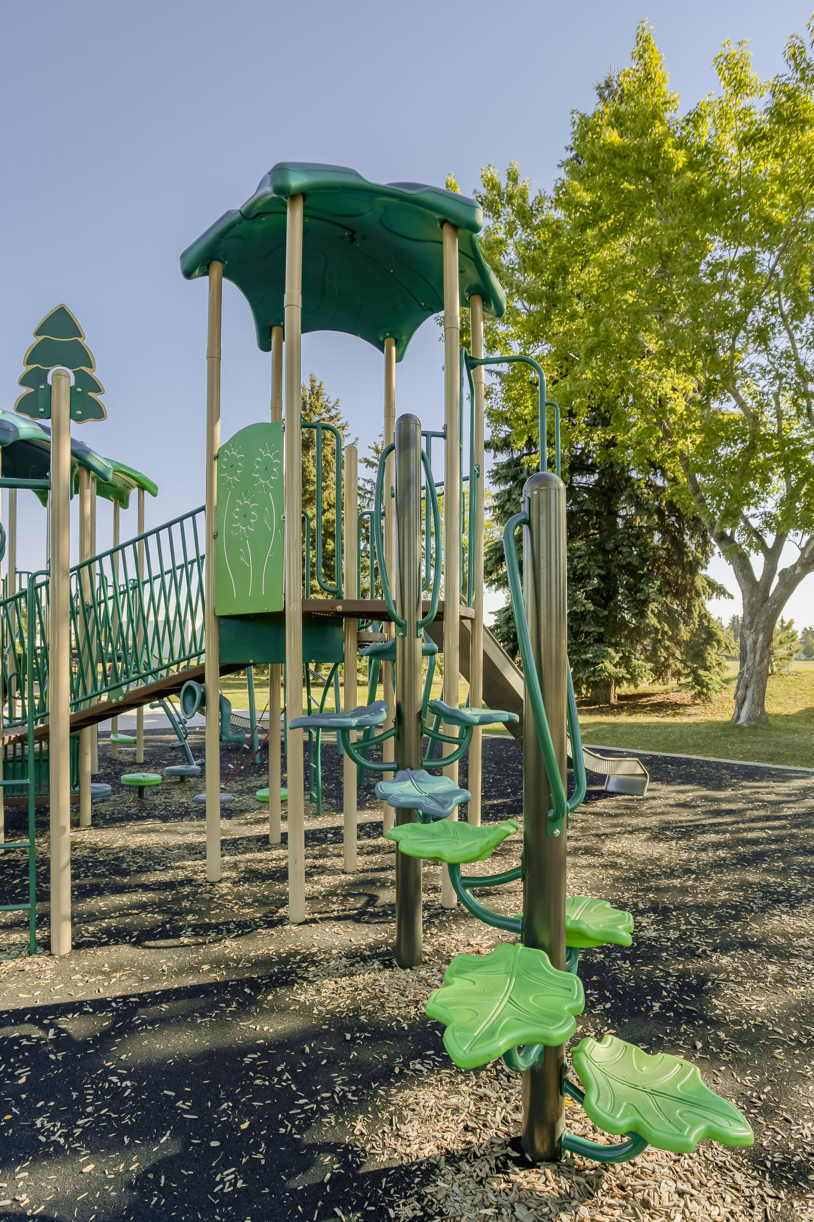 Rundle Heights Community Playground playground equipment in Edmonton, AB with nature-inspired adventure design