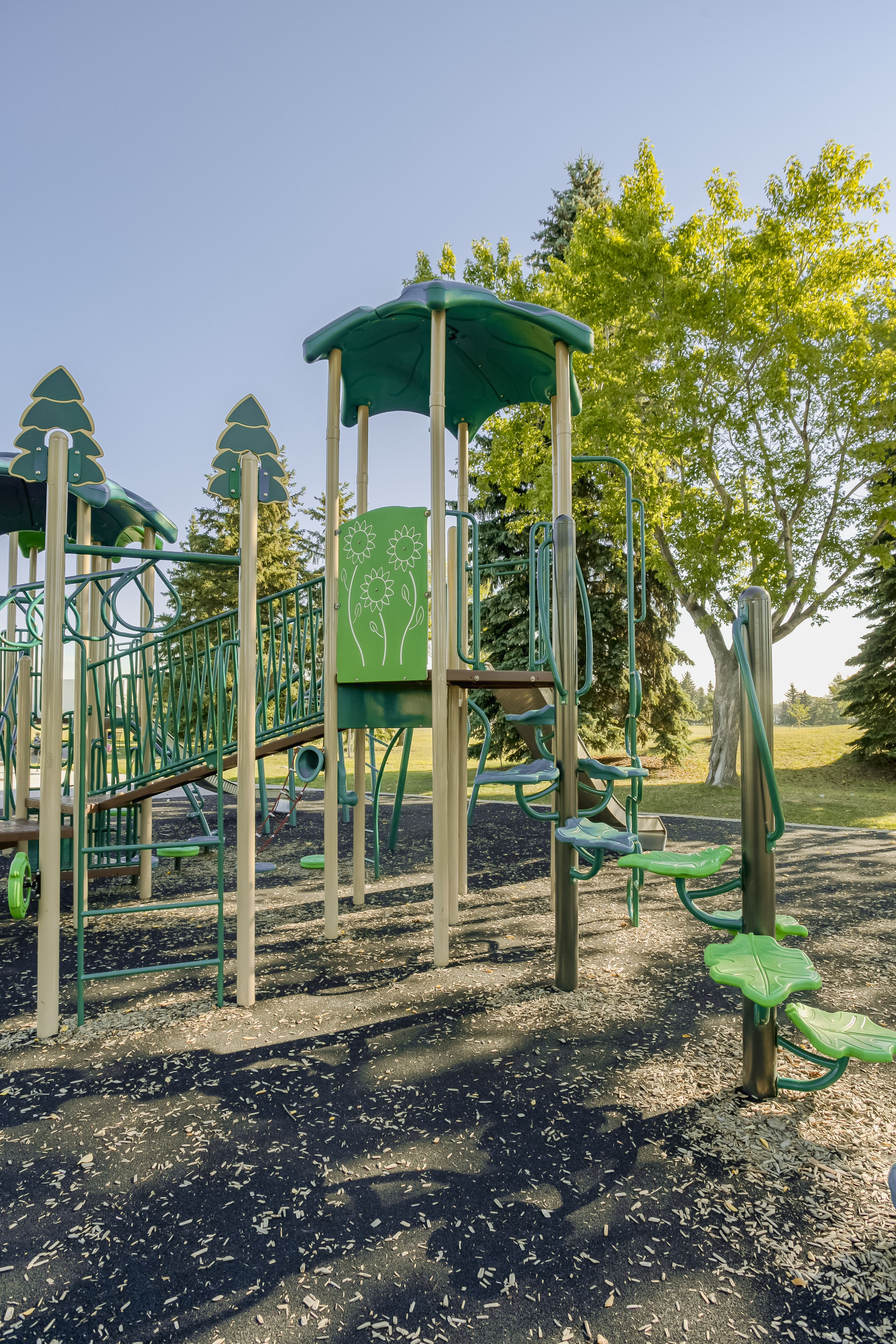 Rundle Heights Community Playground playground equipment in Edmonton, AB with towering climbing challenges