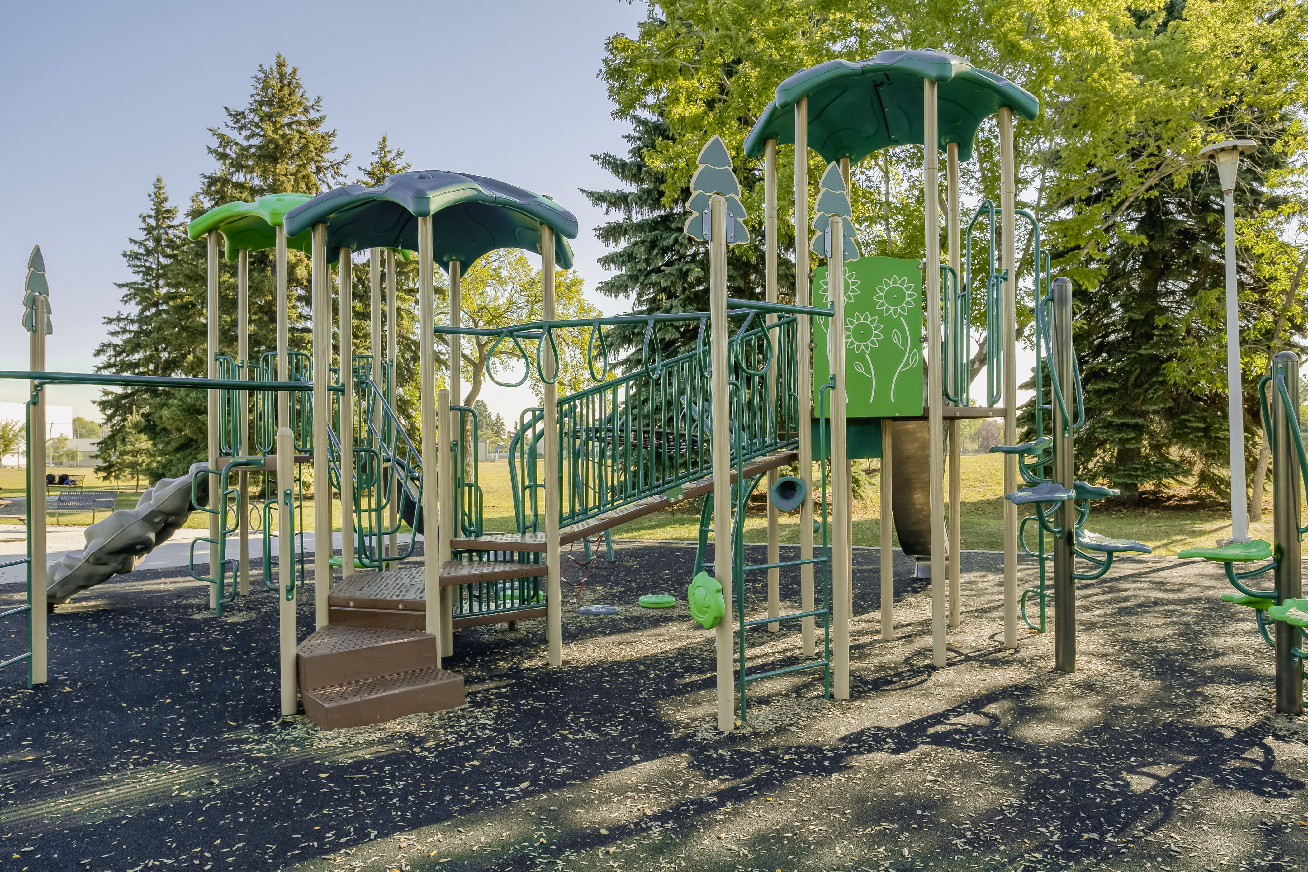 Rundle Heights Community Playground playground equipment in Edmonton, AB featuring modern playground design