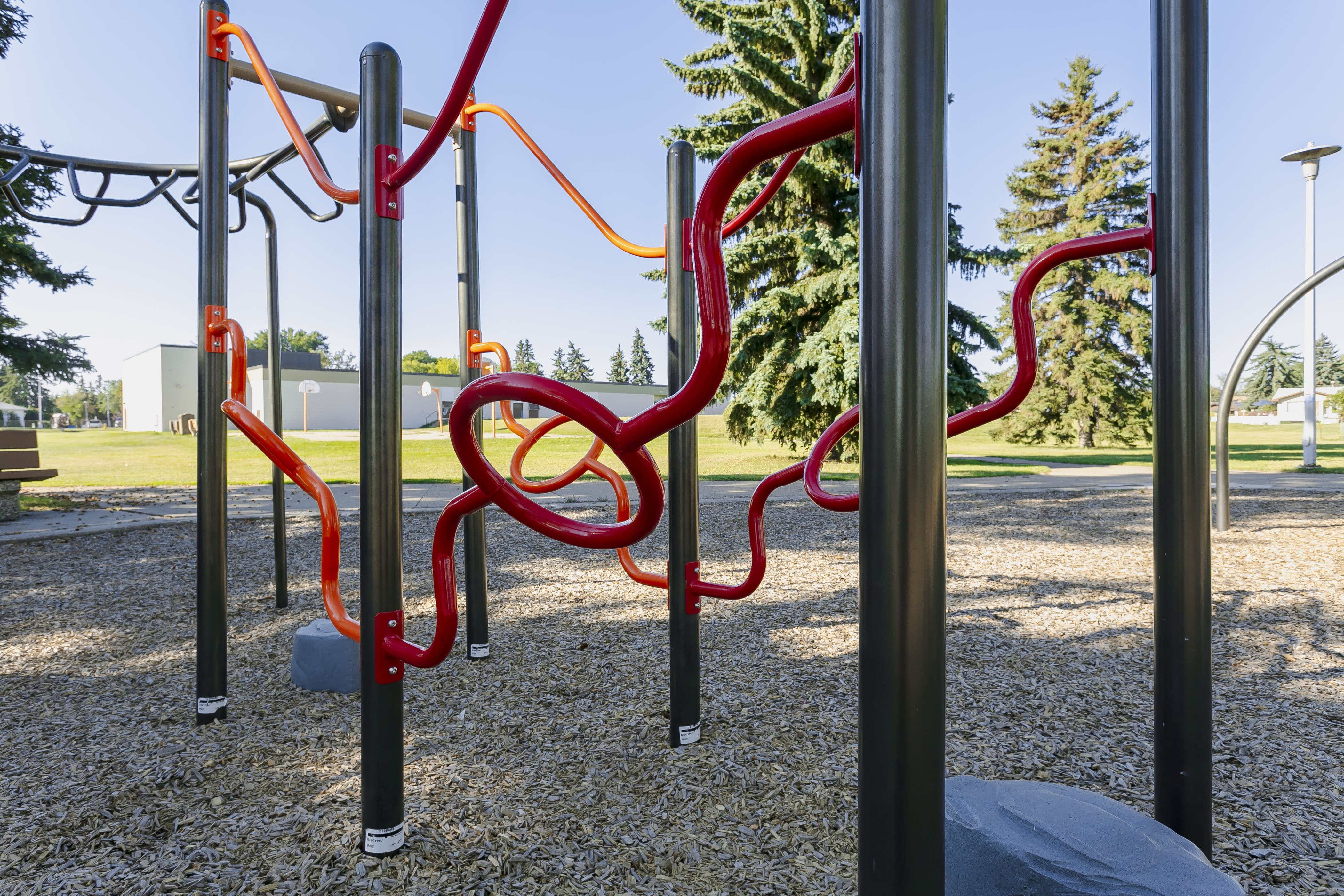 Rundle Heights Community Playground playground equipment in Edmonton, AB showing spider net climber