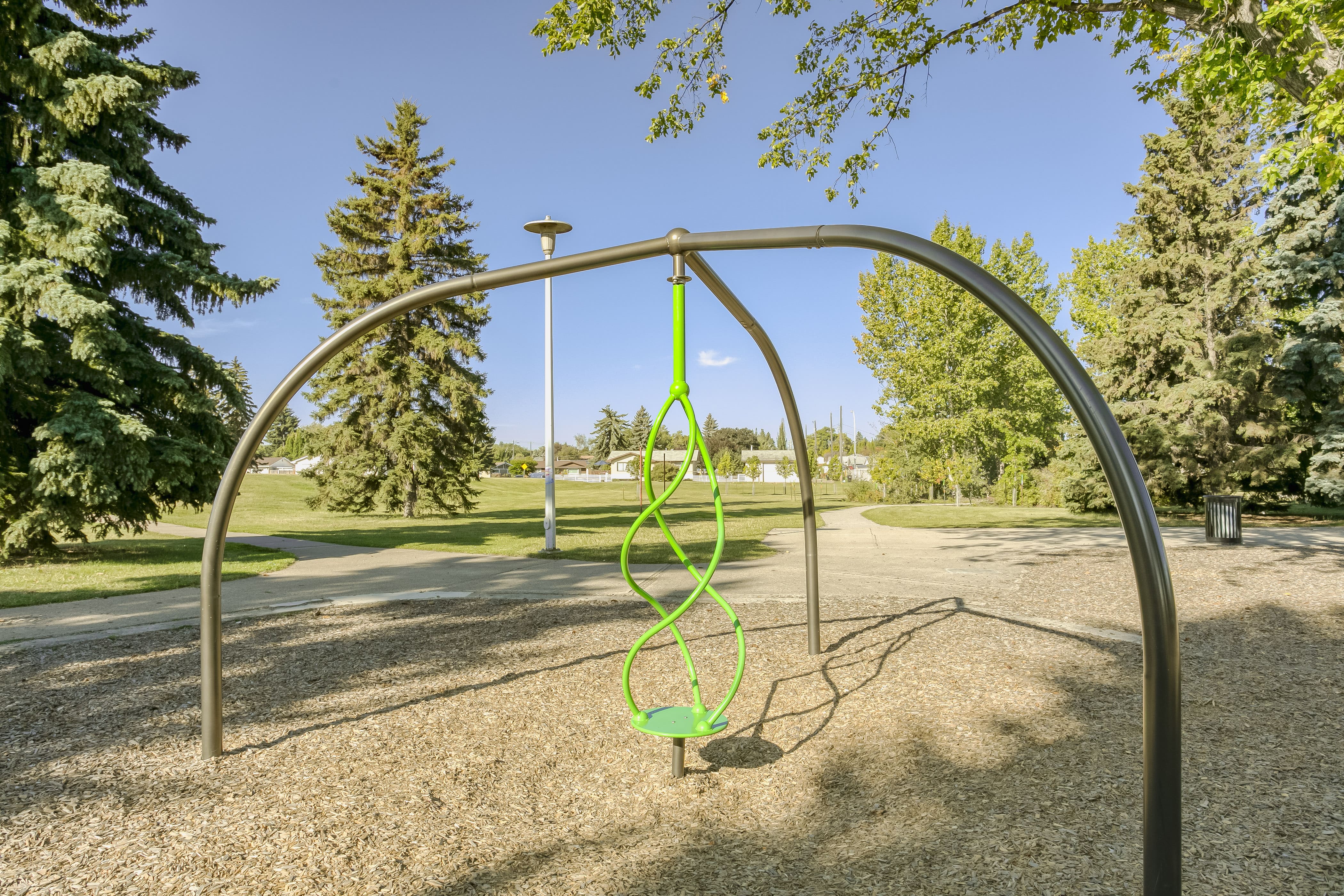 Rundle Heights Community Playground playground equipment in Edmonton, AB showing community playground space