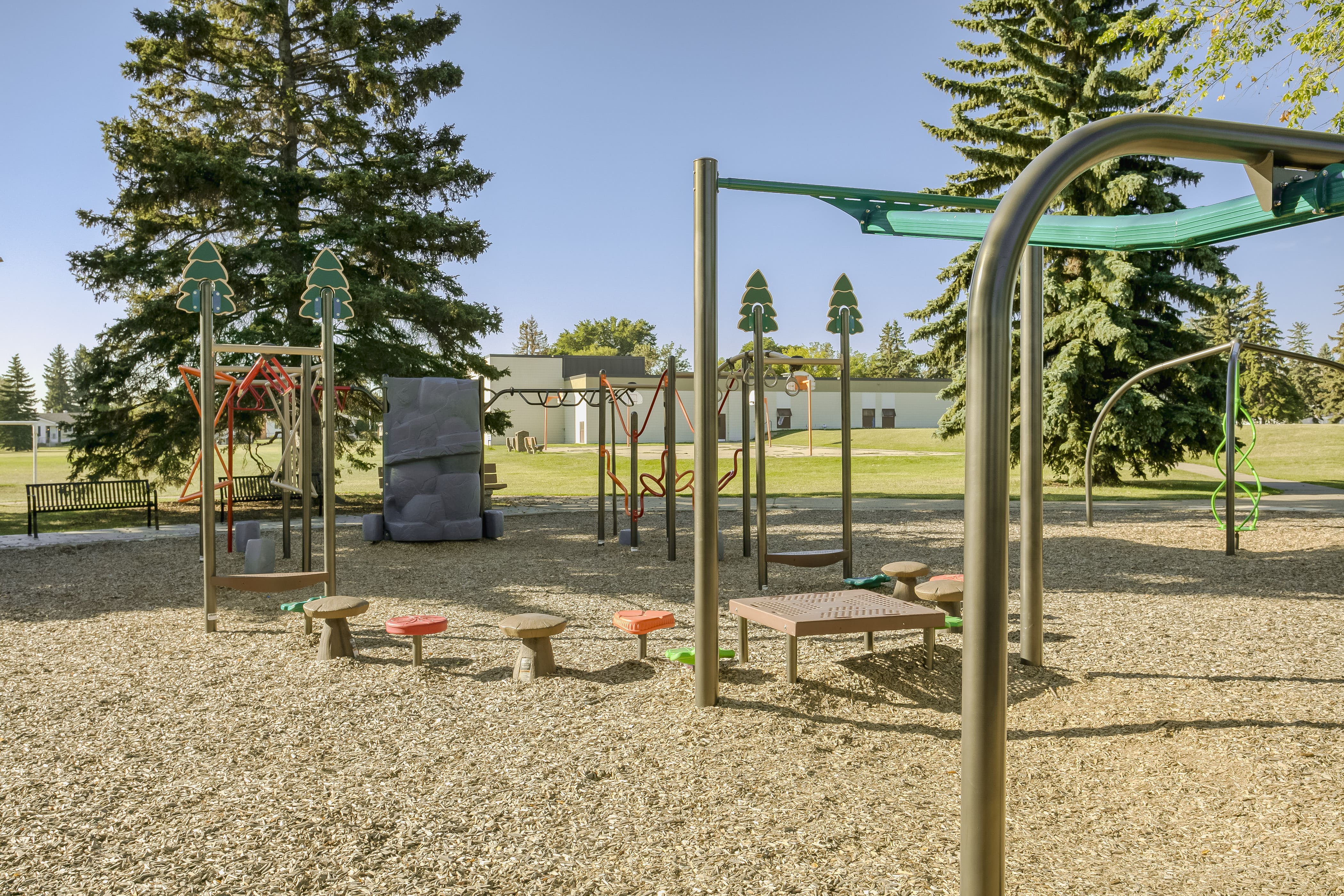 Rundle Heights Community Playground playground equipment in Edmonton, AB showing dynamic color palette