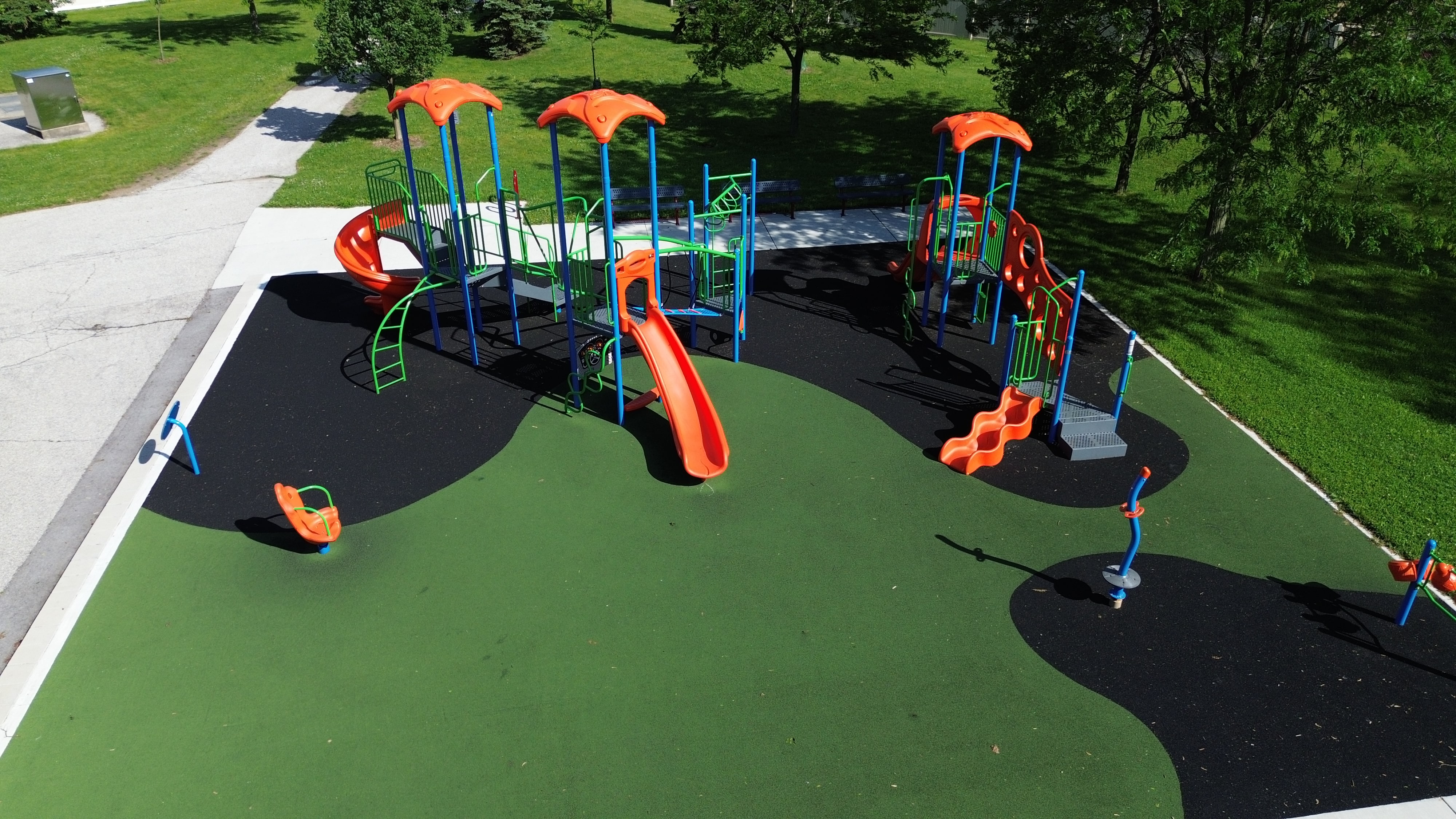 South Rendezvous Park playground equipment in Windsor, ON featuring colorful play structures