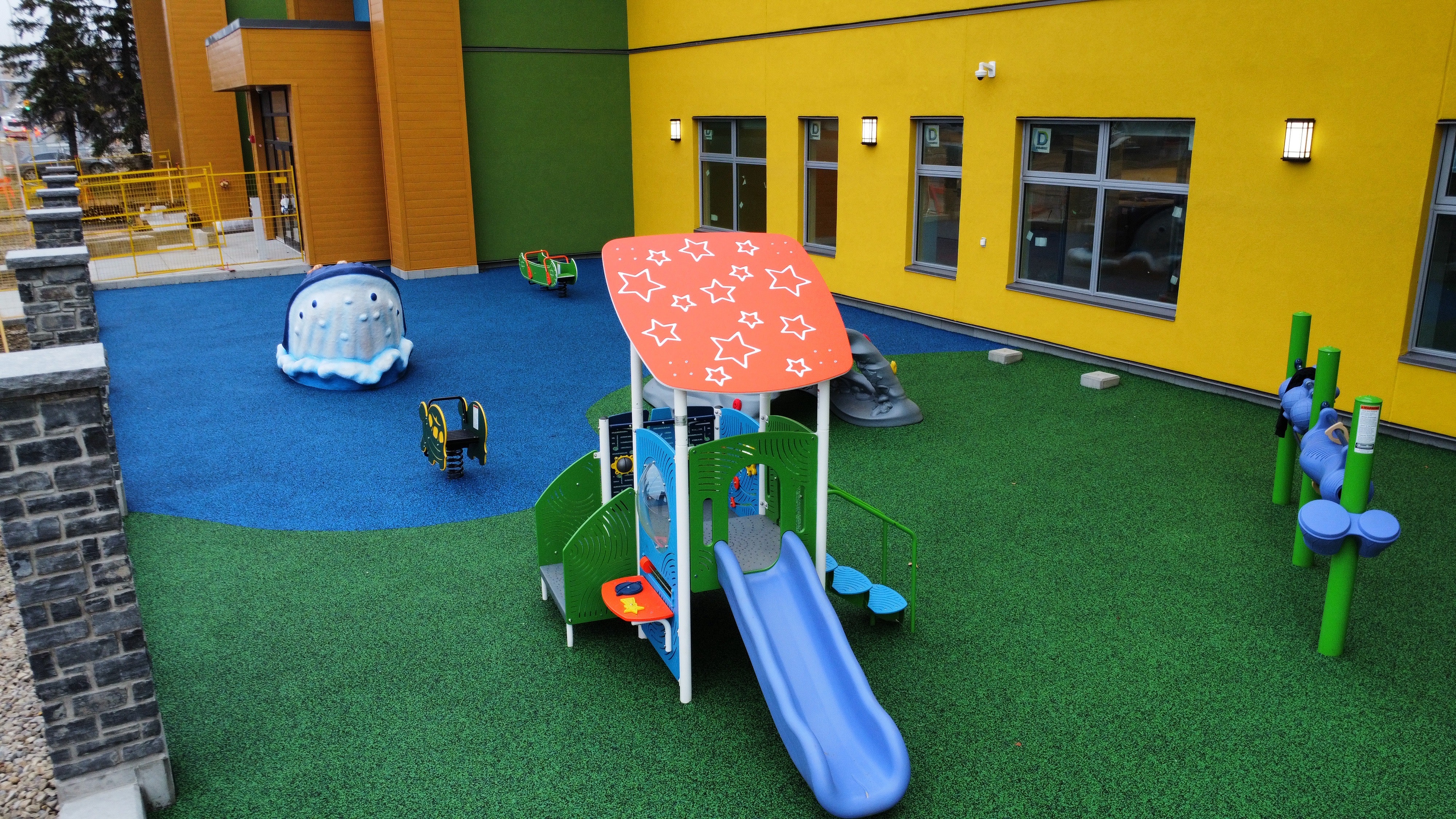 Children's Cottage Society playground equipment in Calgary, AB showing accessible play equipment