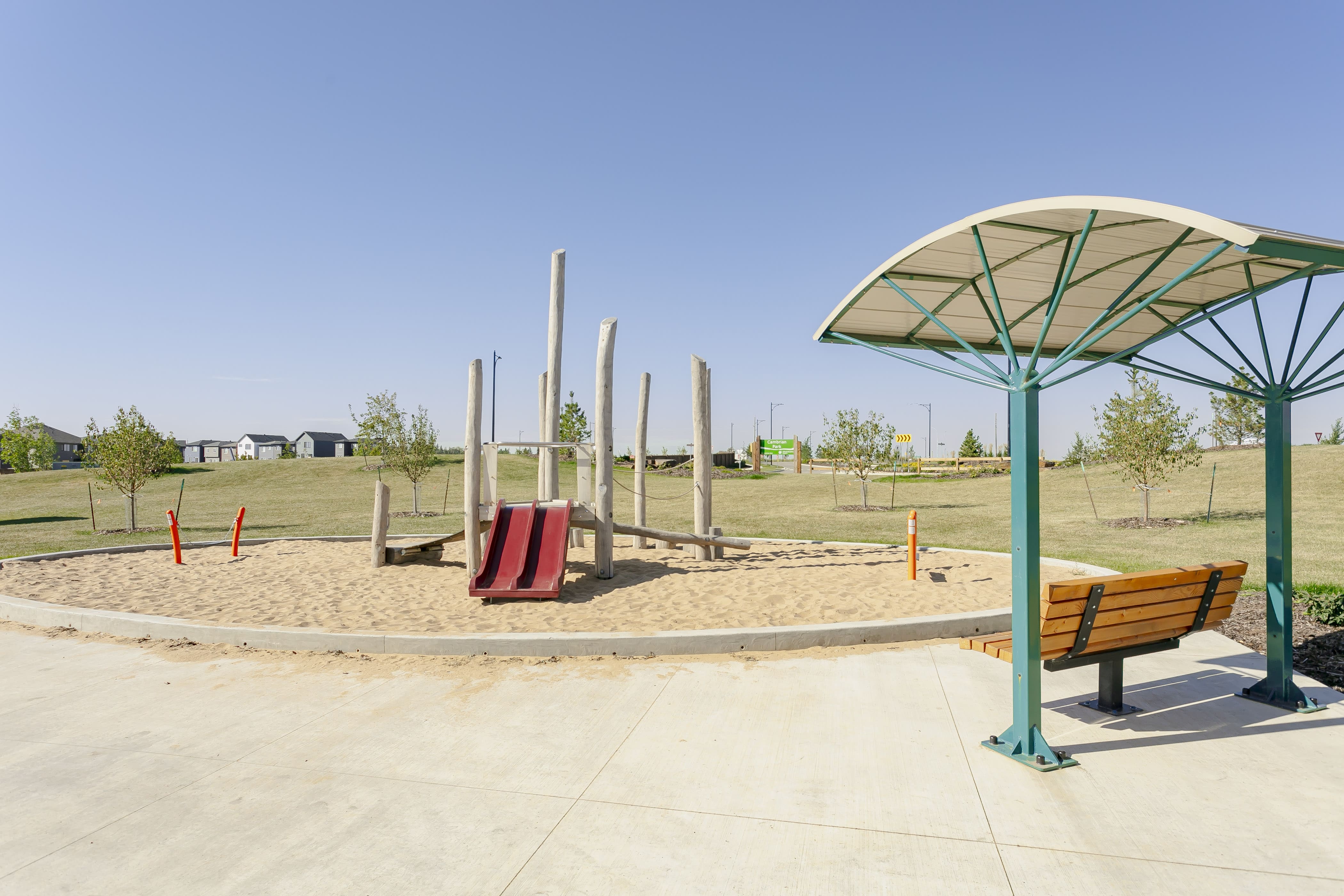 Cambrian Playground playground equipment in Sherwood Park, AB with colorful translucent tower panels