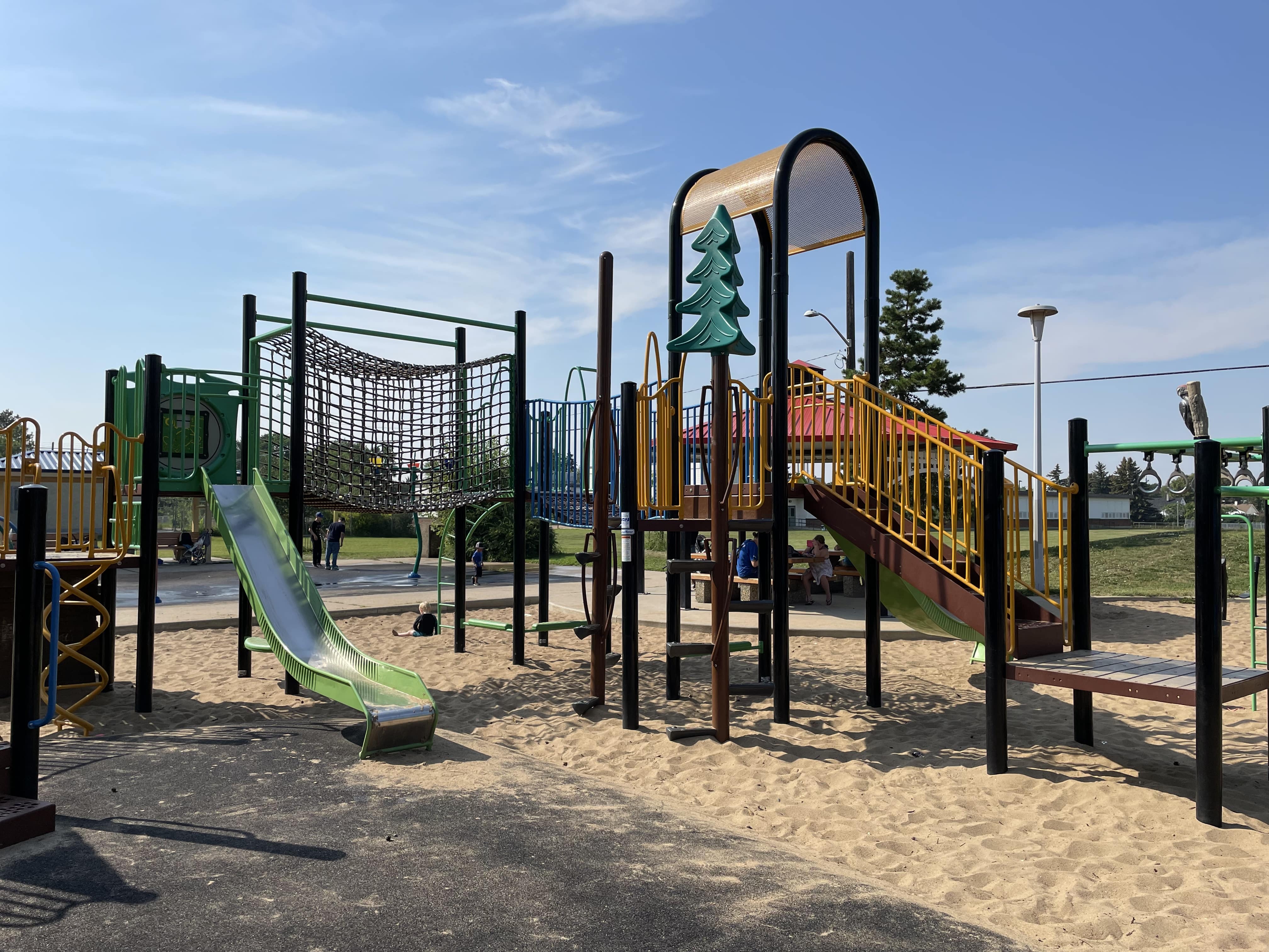 Hazeldean Park playground equipment in Edmonton, AB featuring train-themed playground design