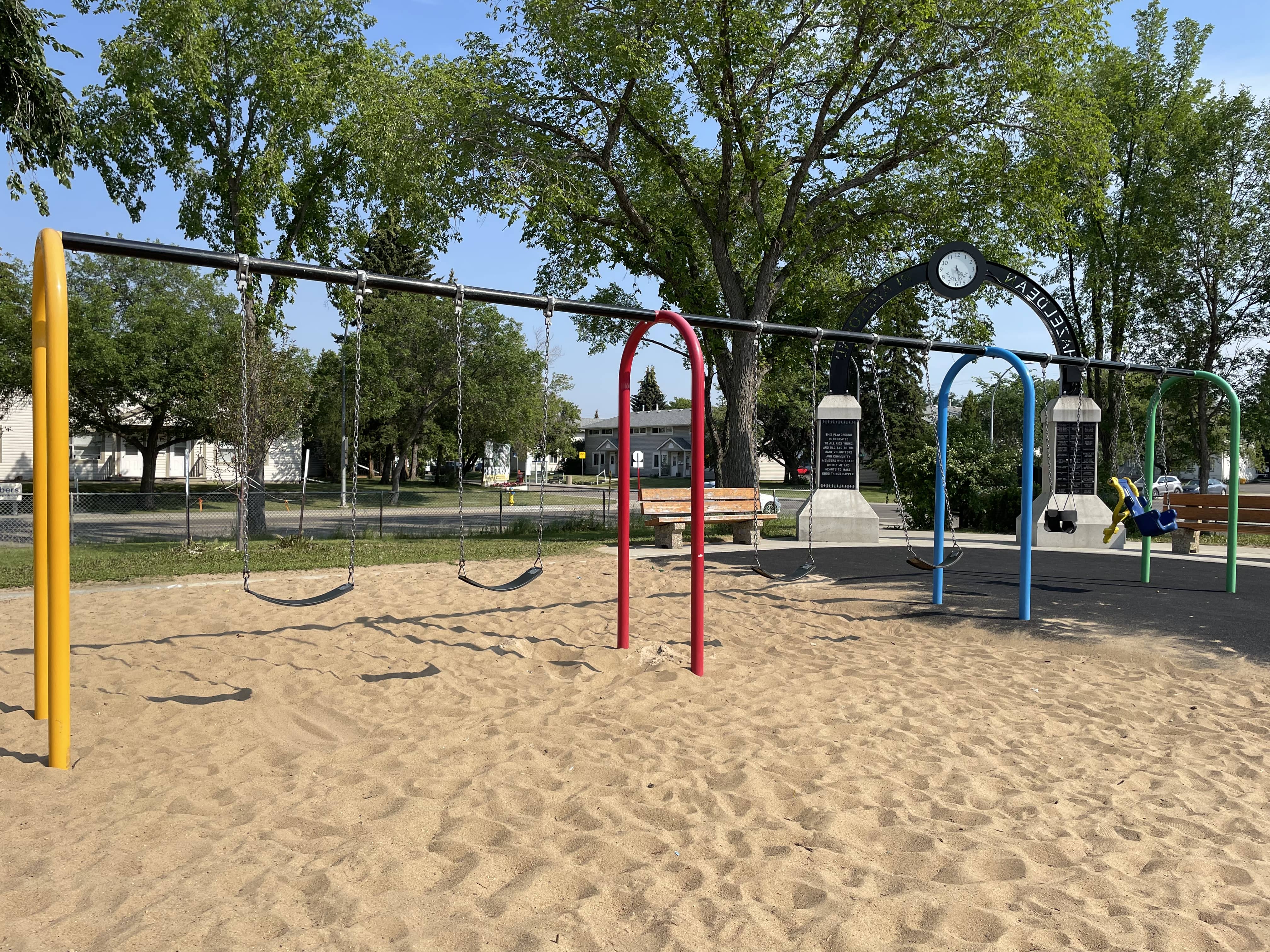 Hazeldean Park playground equipment in Edmonton, AB with unique climbers and big slide