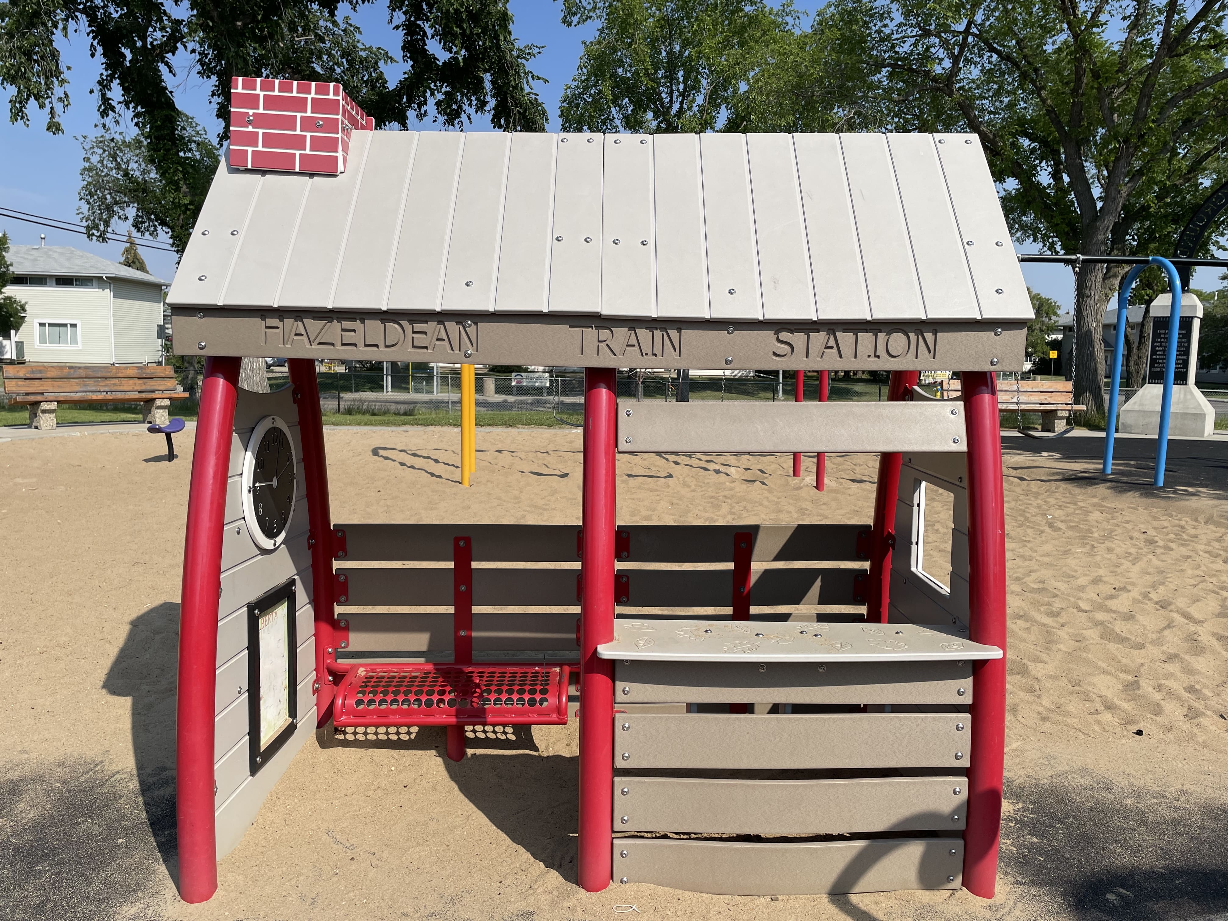 Hazeldean Park playground equipment in Edmonton, AB with teeter-totter and musical drums