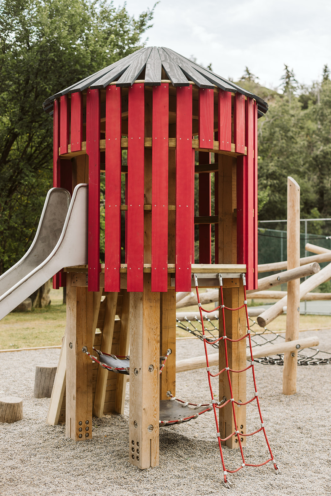 Rideau Roxboro Natural Community Playground playground equipment in Calgary, AB featuring ages 5-12 years design
