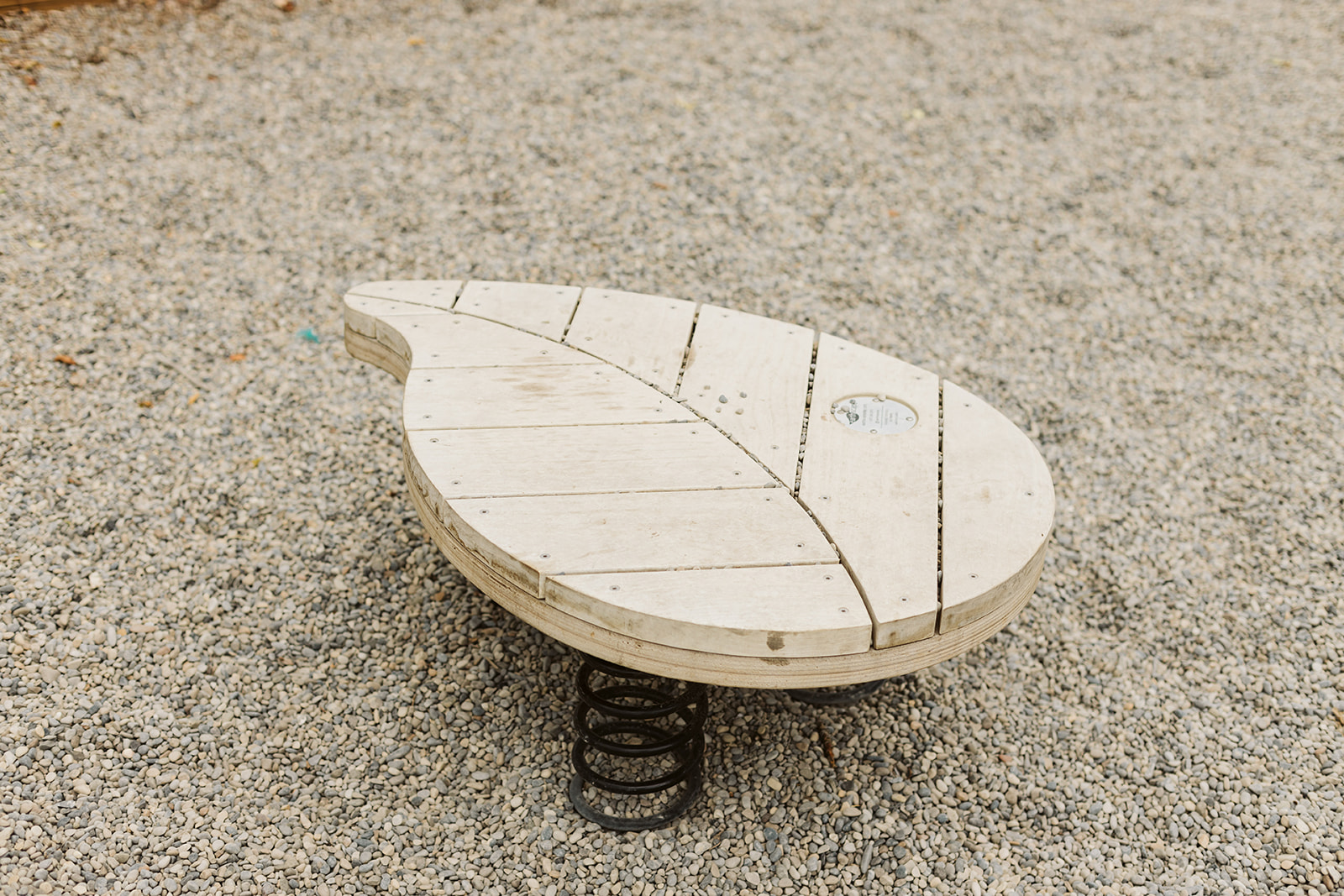 Rideau Roxboro Natural Community Playground playground equipment in Calgary, AB showing ages 18 months-5 years area