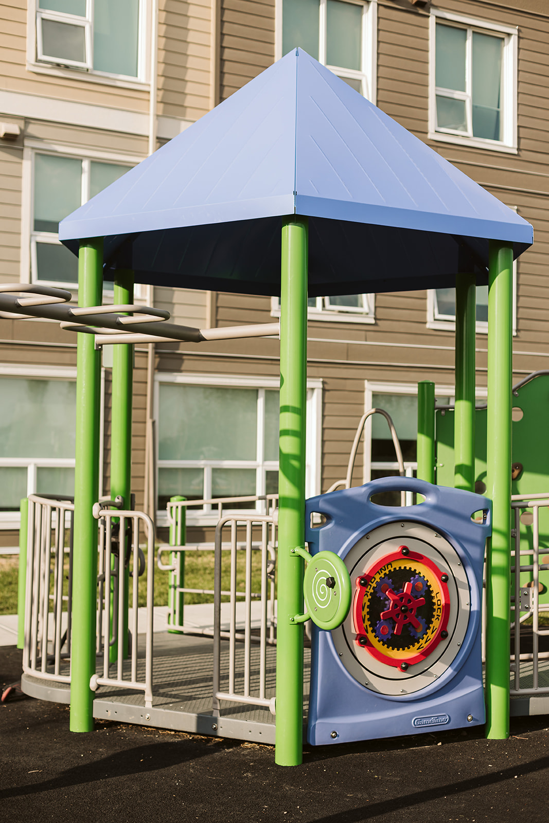 Horizon Housing playground equipment in Calgary, AB with colorful play structures