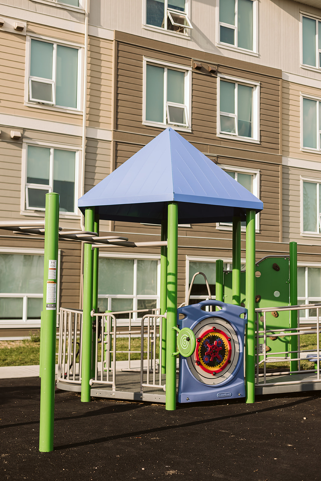 Horizon Housing playground equipment in Calgary, AB showing accessible play equipment
