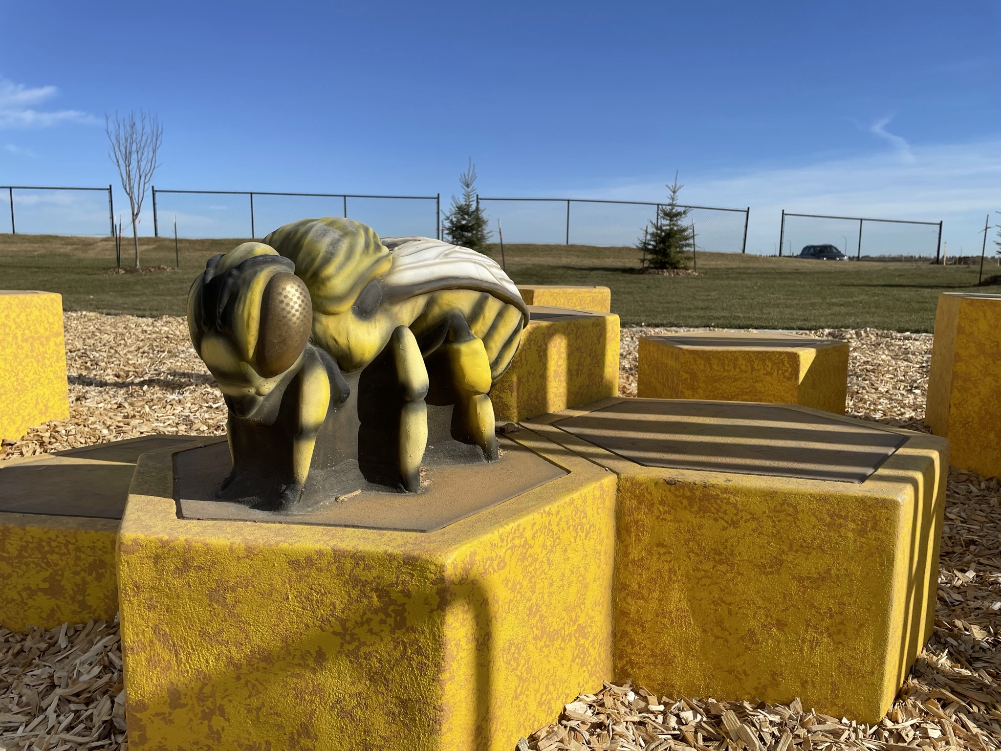 Uplands Playground playground in Edmonton, AB with accessible playground, inclusive design, Qualico Communities