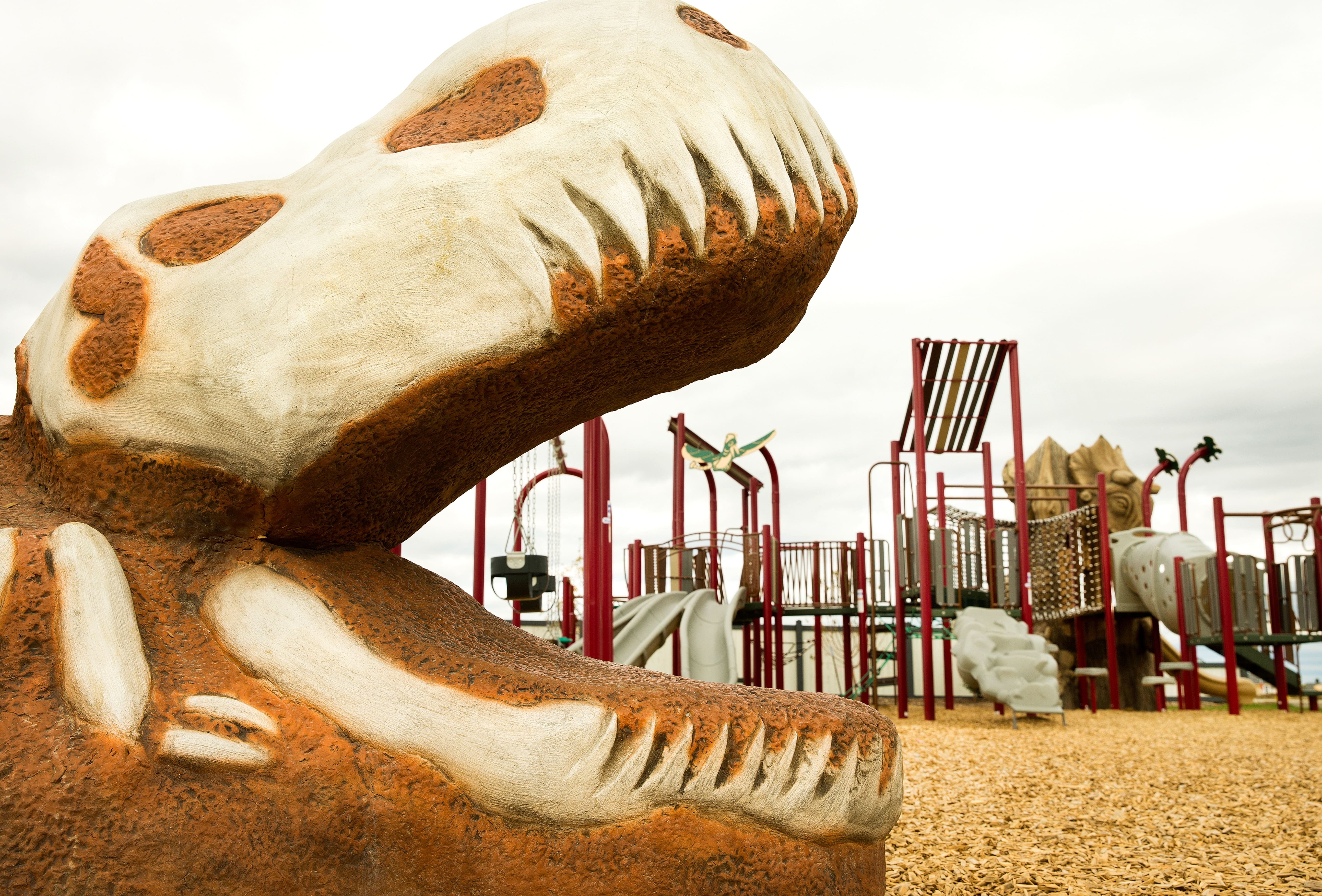 Meadowview Dinosaur Park in Leduc, AB featuring dinosaur themed playground with Royal Tyrrell Museum partnership