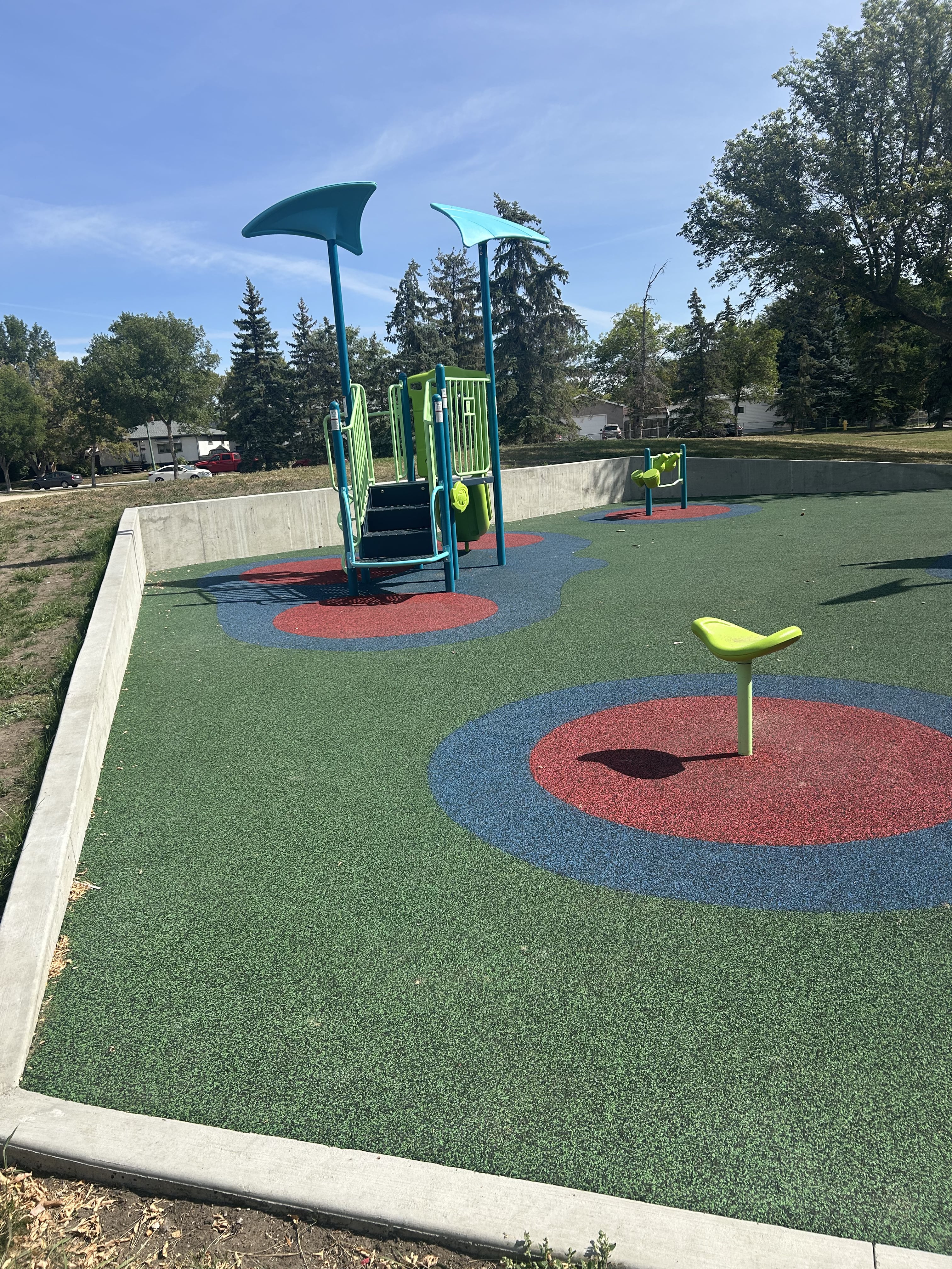 Benson Park playground in Regina, SK - overview of play area and equipment
