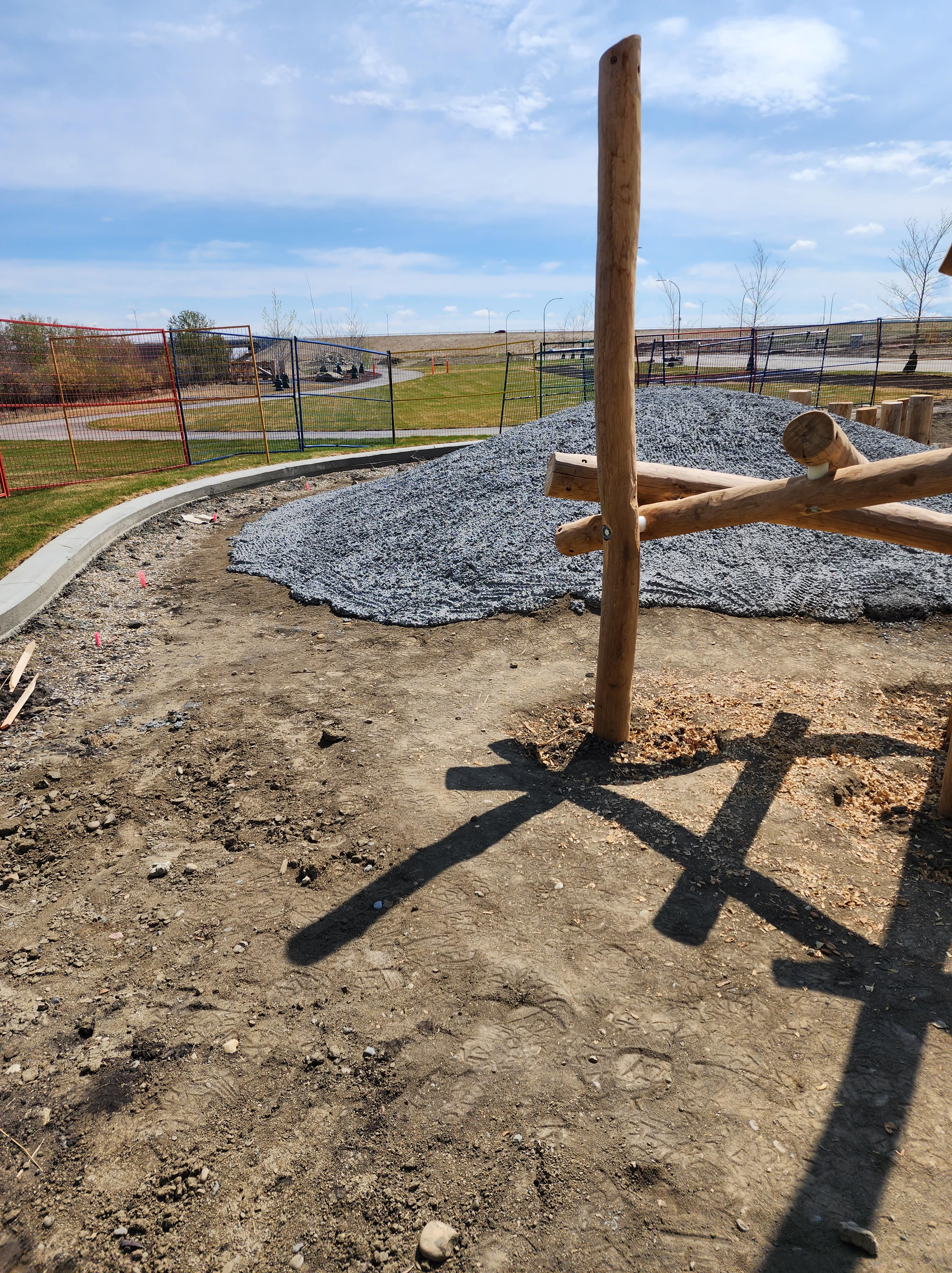 Silverado Community Natural Playground (Calgary, AB) playground - children playing on equipment
