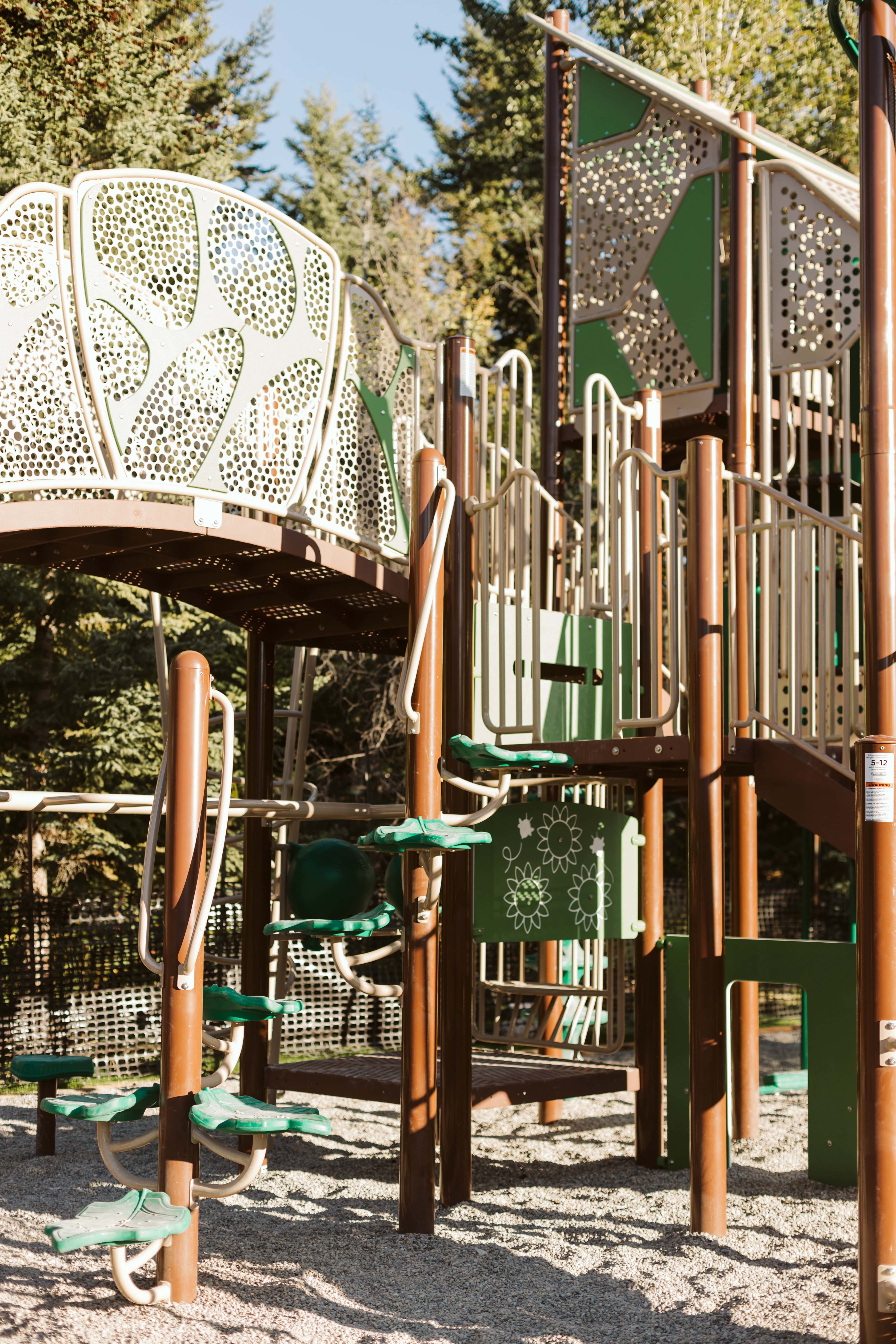 Lady MacDonald Park (Canmore, AB) playground in Canmore, AB - play area surfacing and safety features