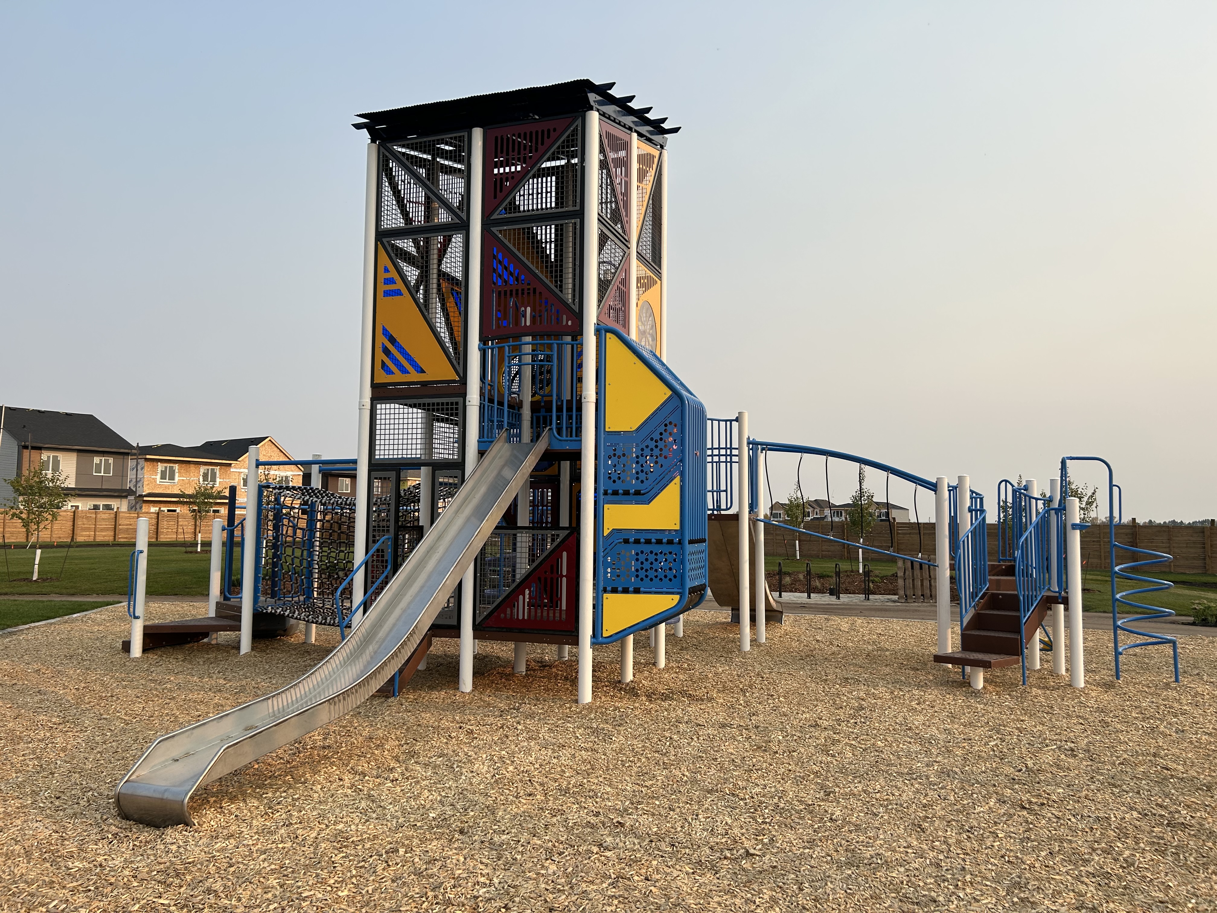Marquis Playground (Edmonton, AB) playground in Edmonton, AB - children playing on equipment