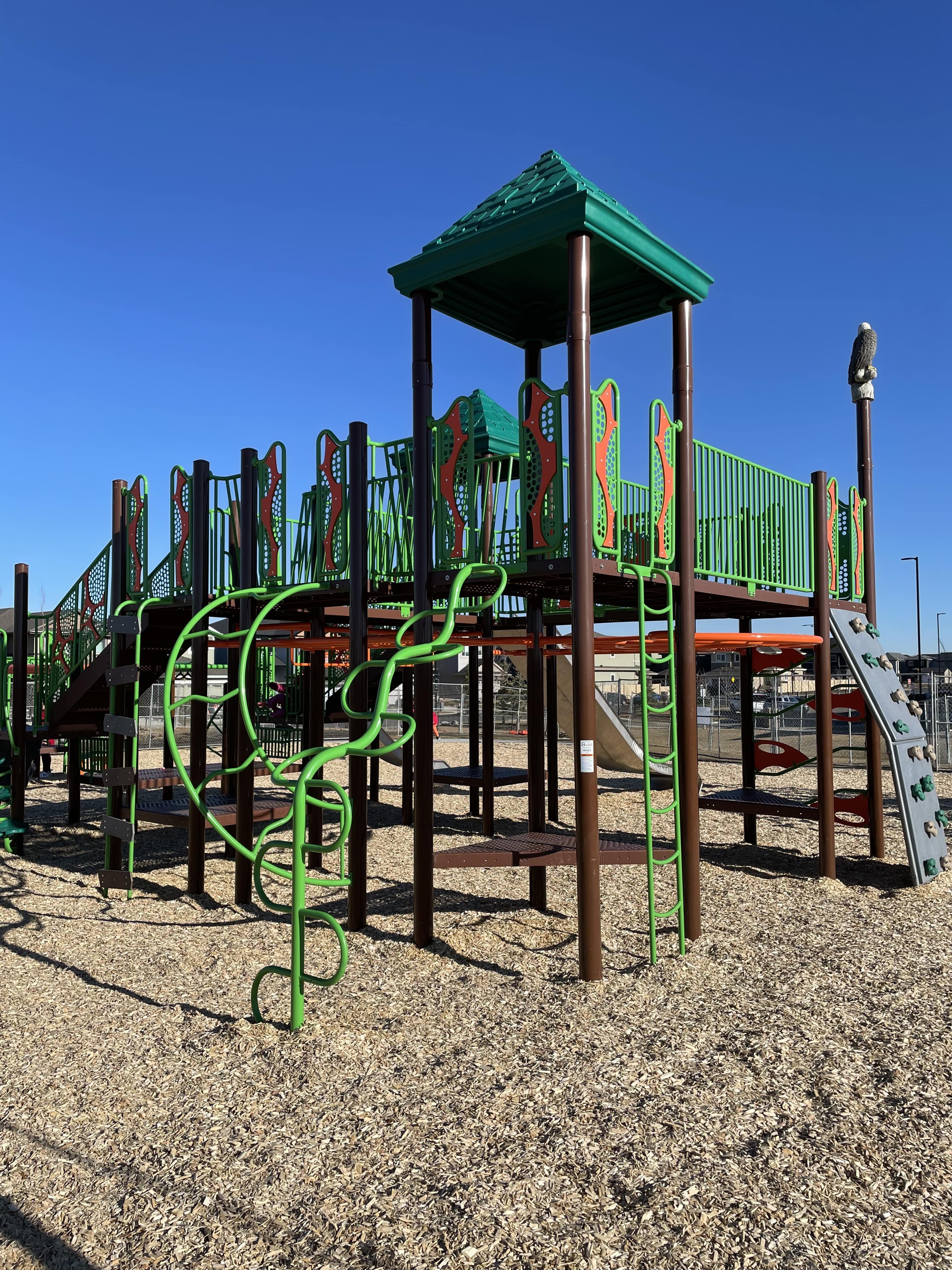 Shauna May Seneca School playground in Edmonton, AB - colorful playground equipment
