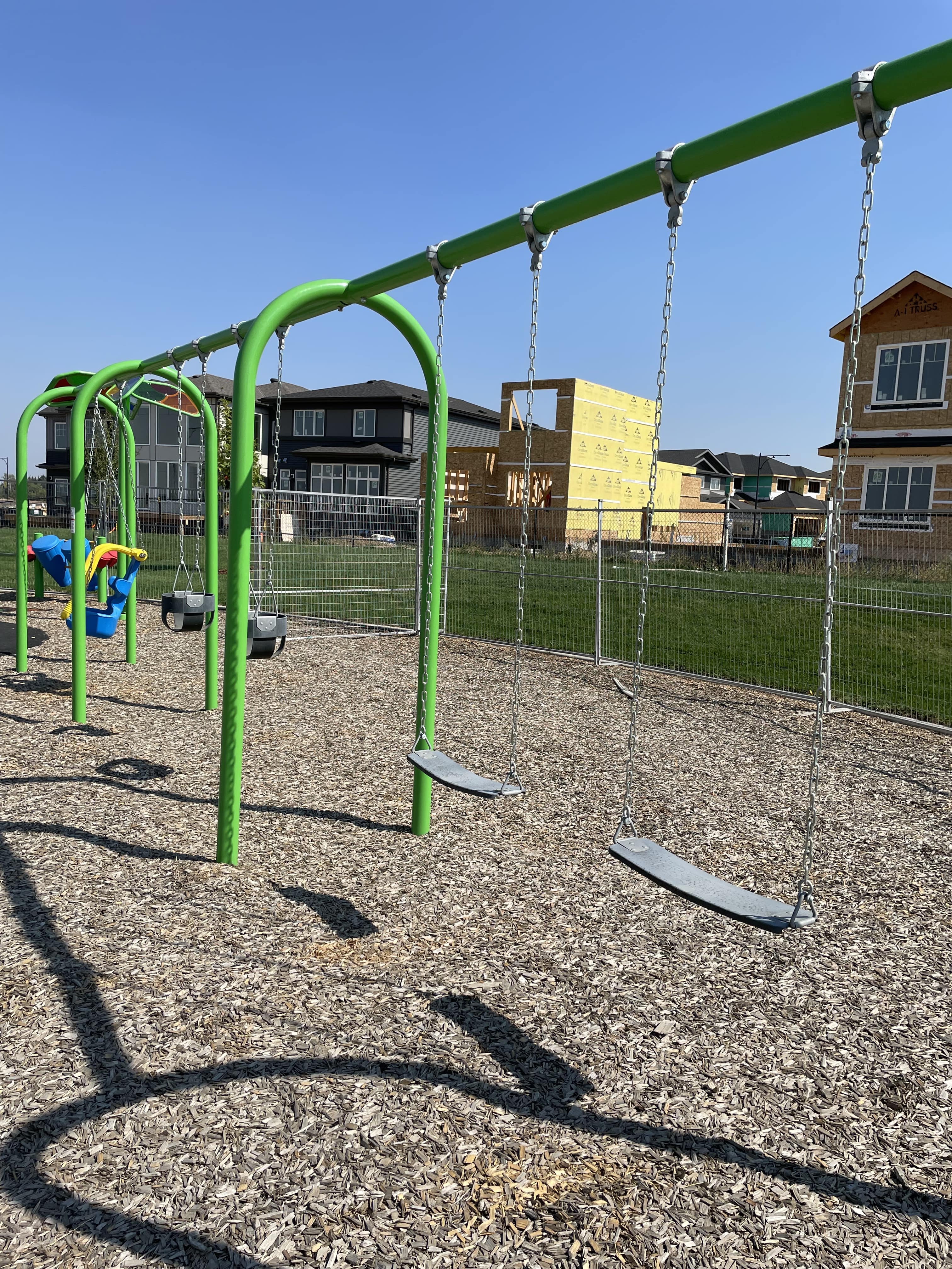 Kinglet Gardens (Edmonton, AB) playground in Edmonton, AB - playground swings and slides