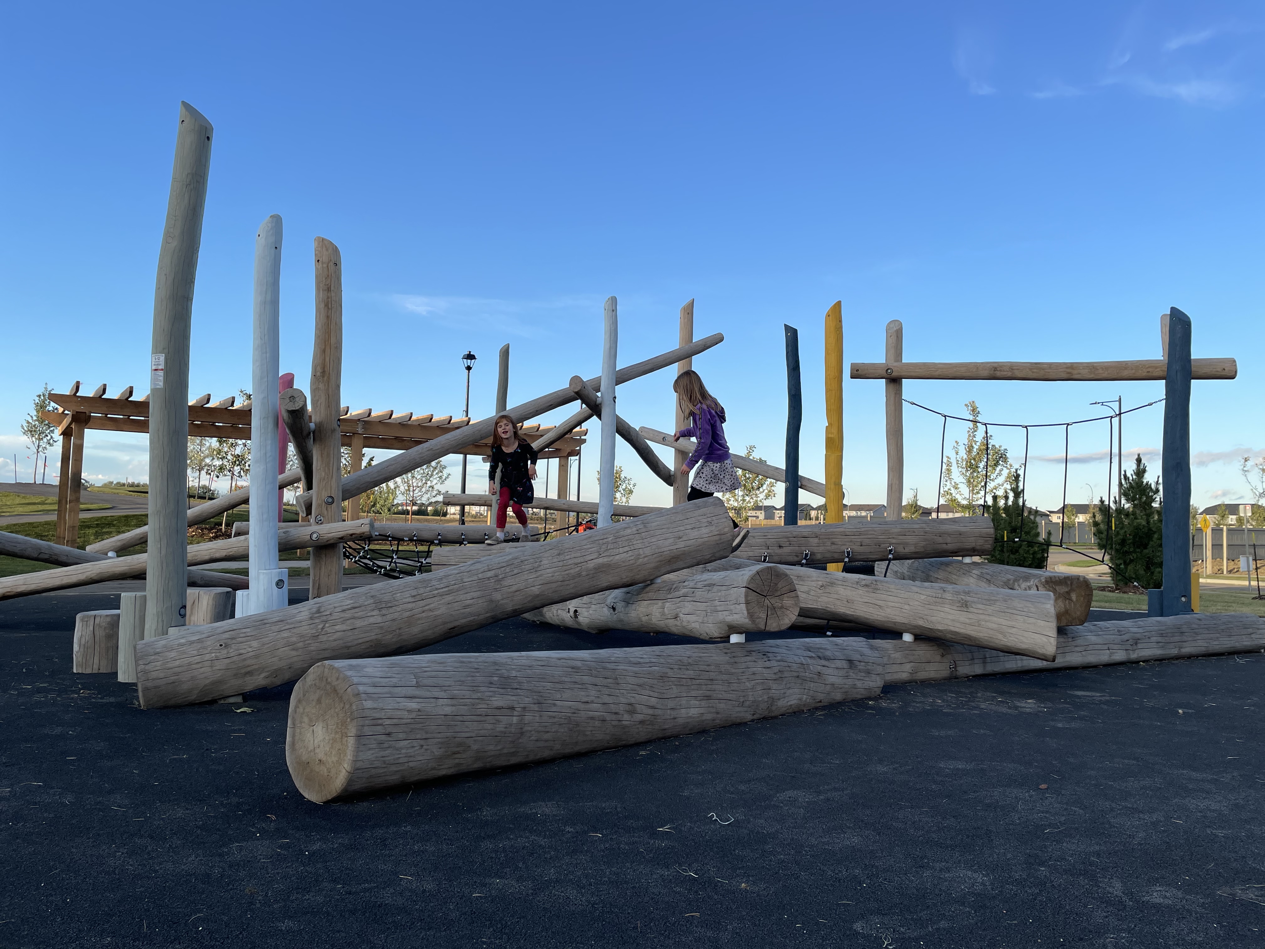 Parc Réunis playground in Beaumont, AB - natural and built play elements