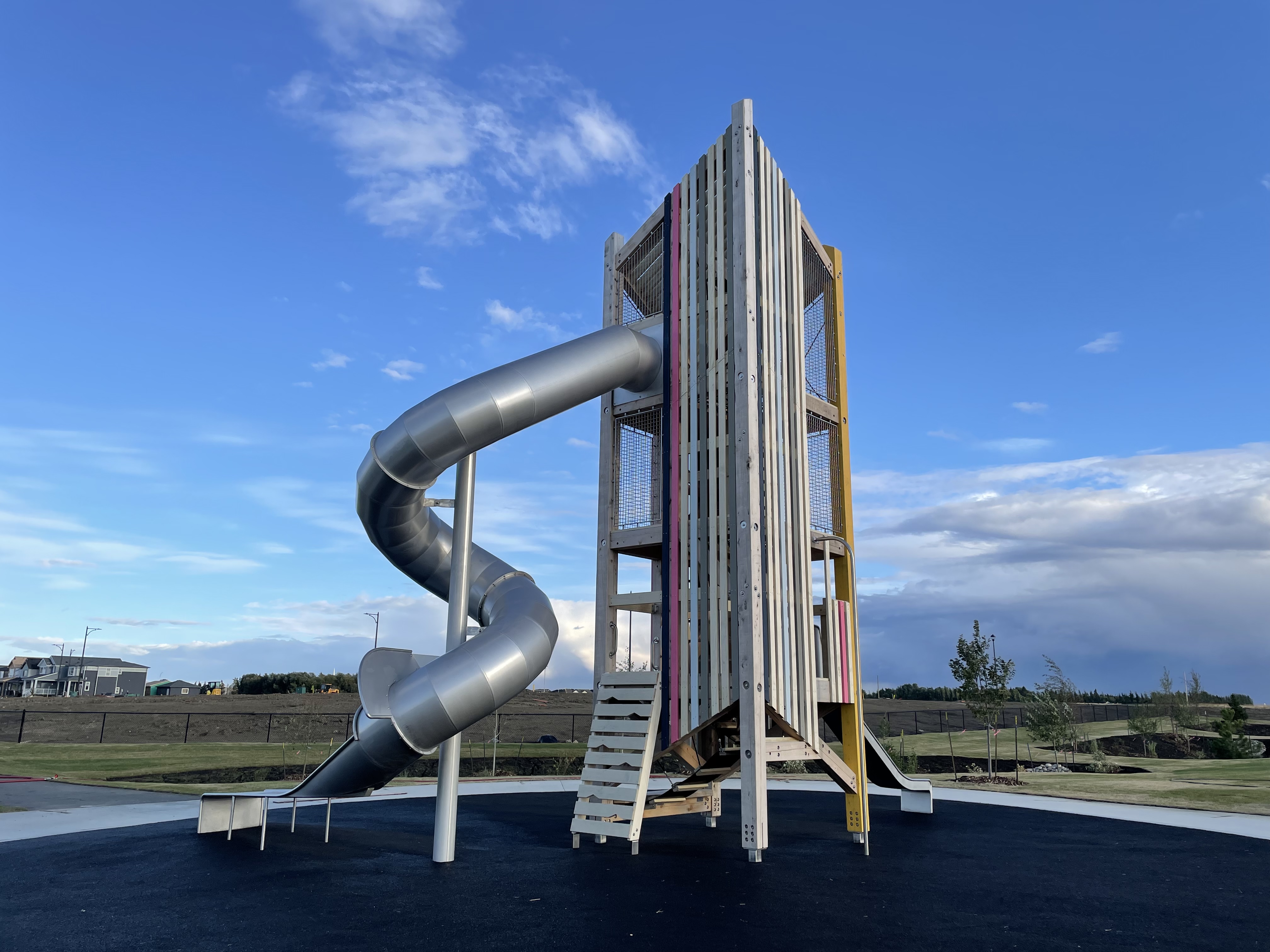 Parc Réunis playground in Beaumont, AB - overview of play area and equipment