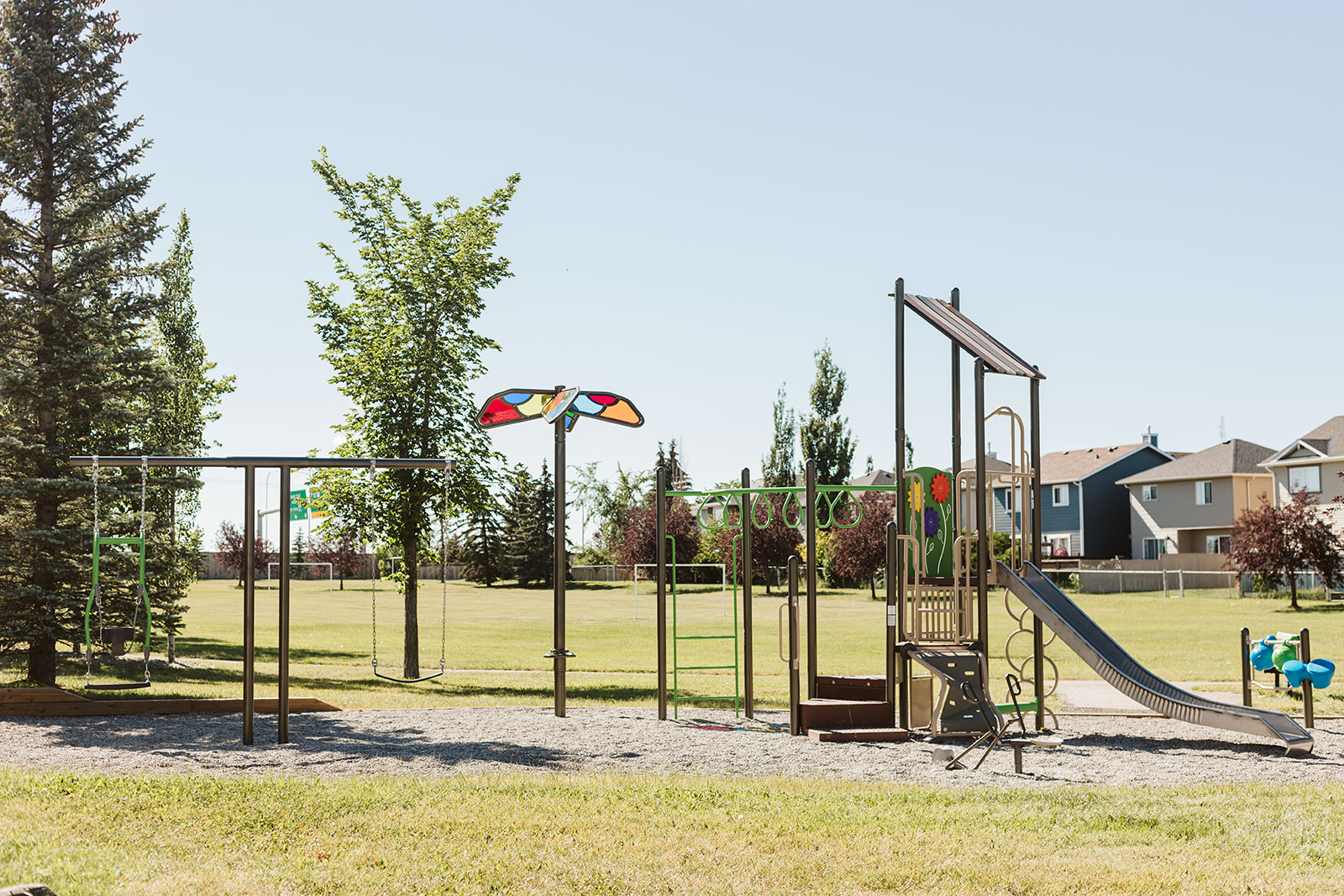 Chapalina Crescent playground in Calgary, AB - overview of play area and equipment