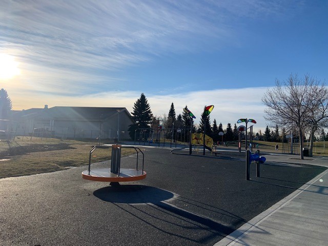 Baturyn Park (Edmonton, AB) playground in Edmonton, AB - overview of play area and equipment