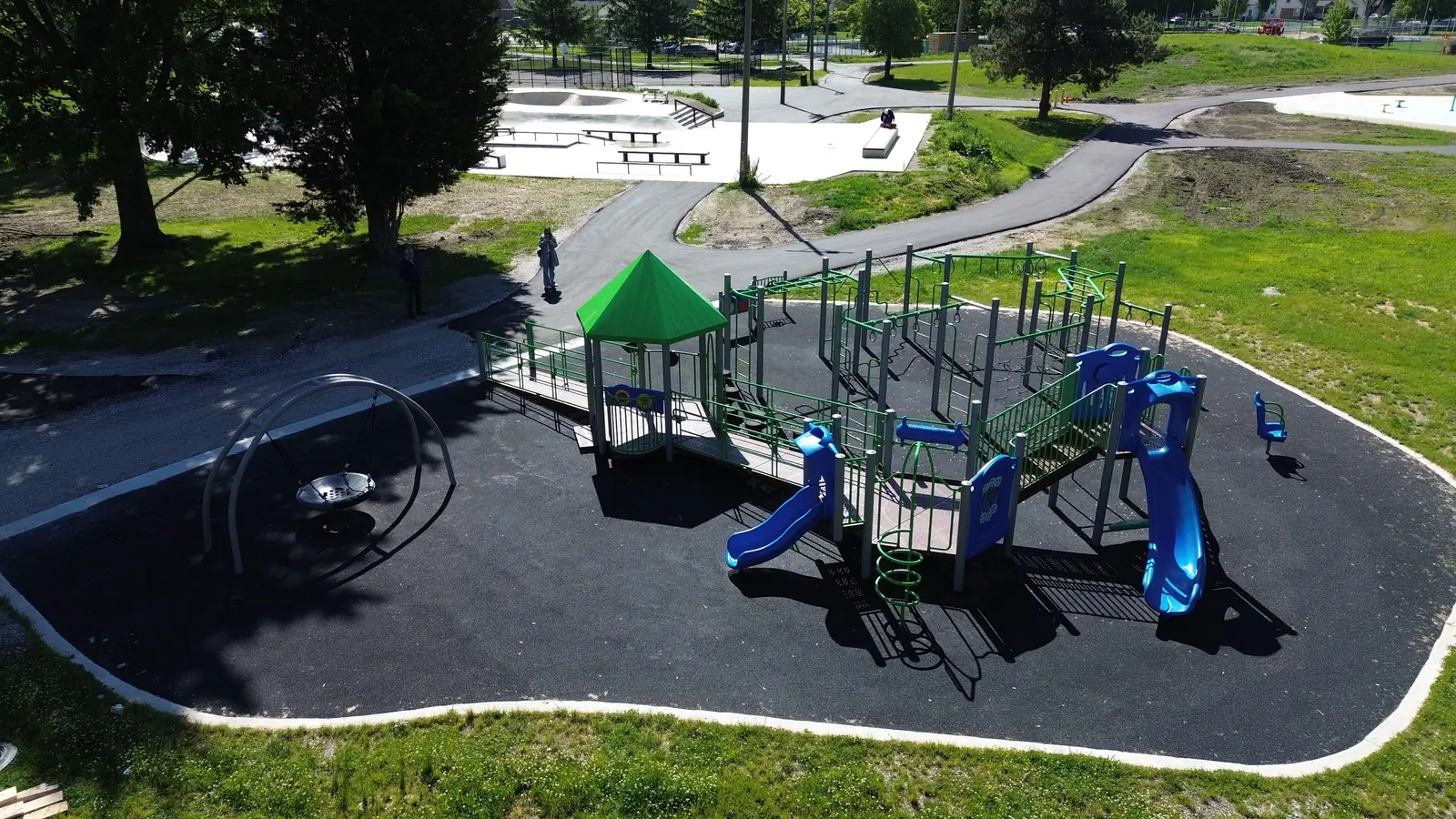 2 blue slides, a green spiral climber and a spring rider off the main deck, seen from above