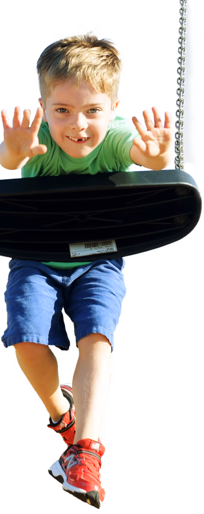 the boy pushing a swing