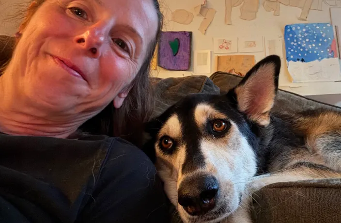 Stormi the dog with their owner.