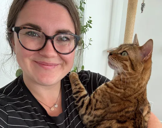 Maple the cat in moms arms.