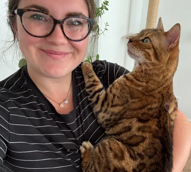 Maple the cat in moms arms.