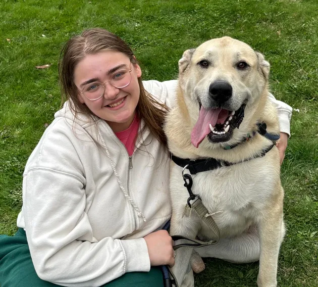 Mister Bear the dog outside with mom.