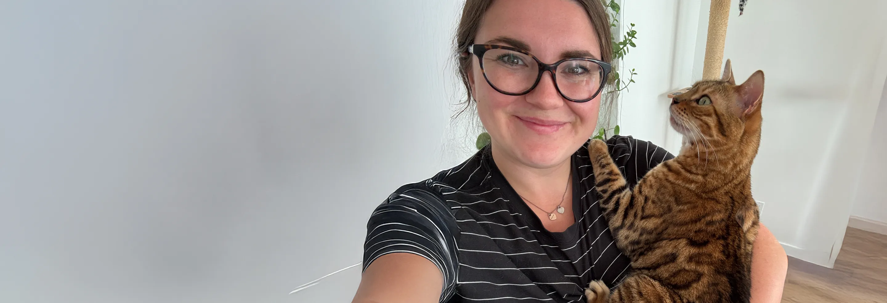 Maple the cat in moms arms.