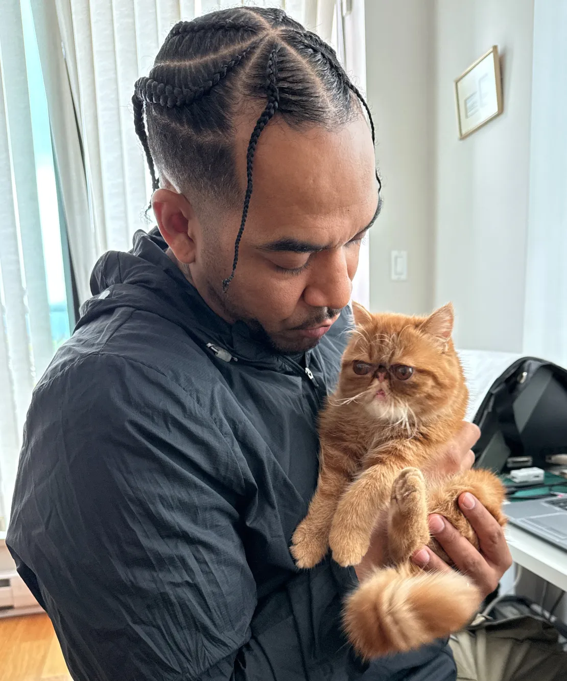 Willemina the cat in dads arms.