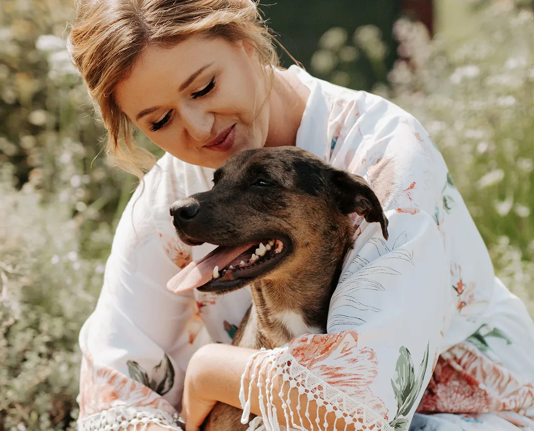 Piper the dog in moms arms.