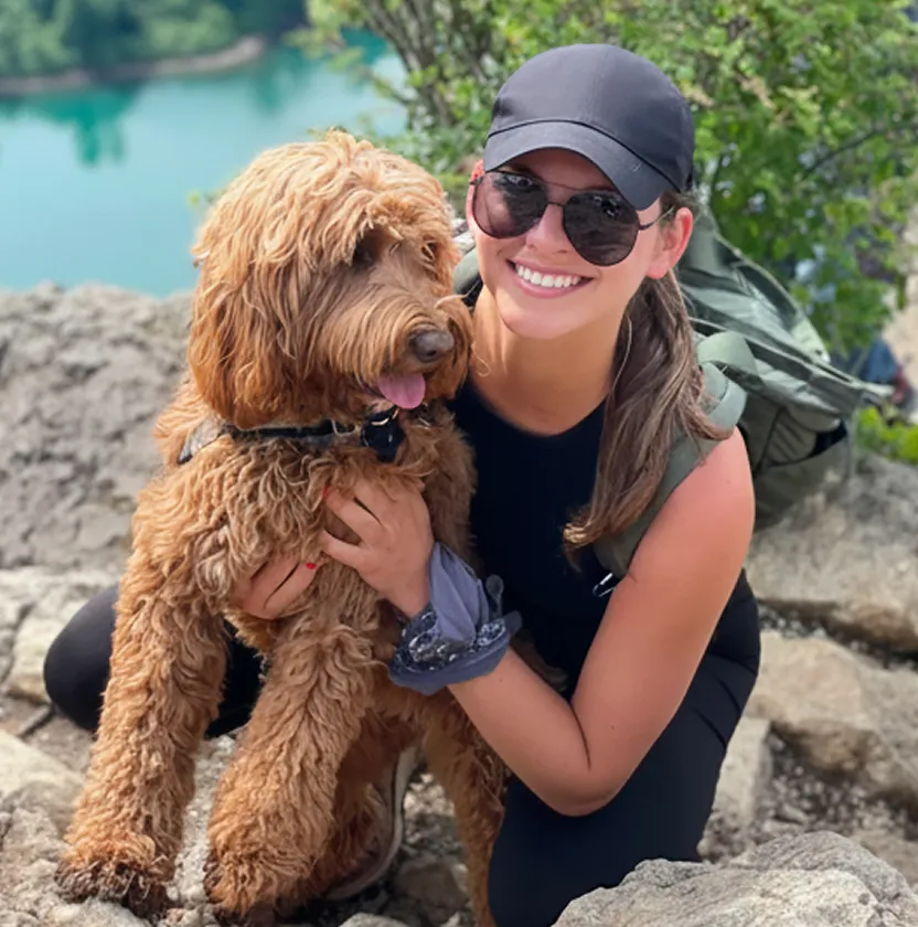 Mulligan the dog posing with mom.