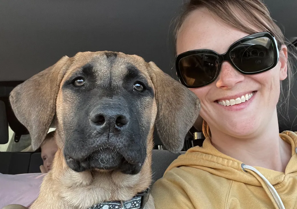 Ruby the dog with their owner, Amber.