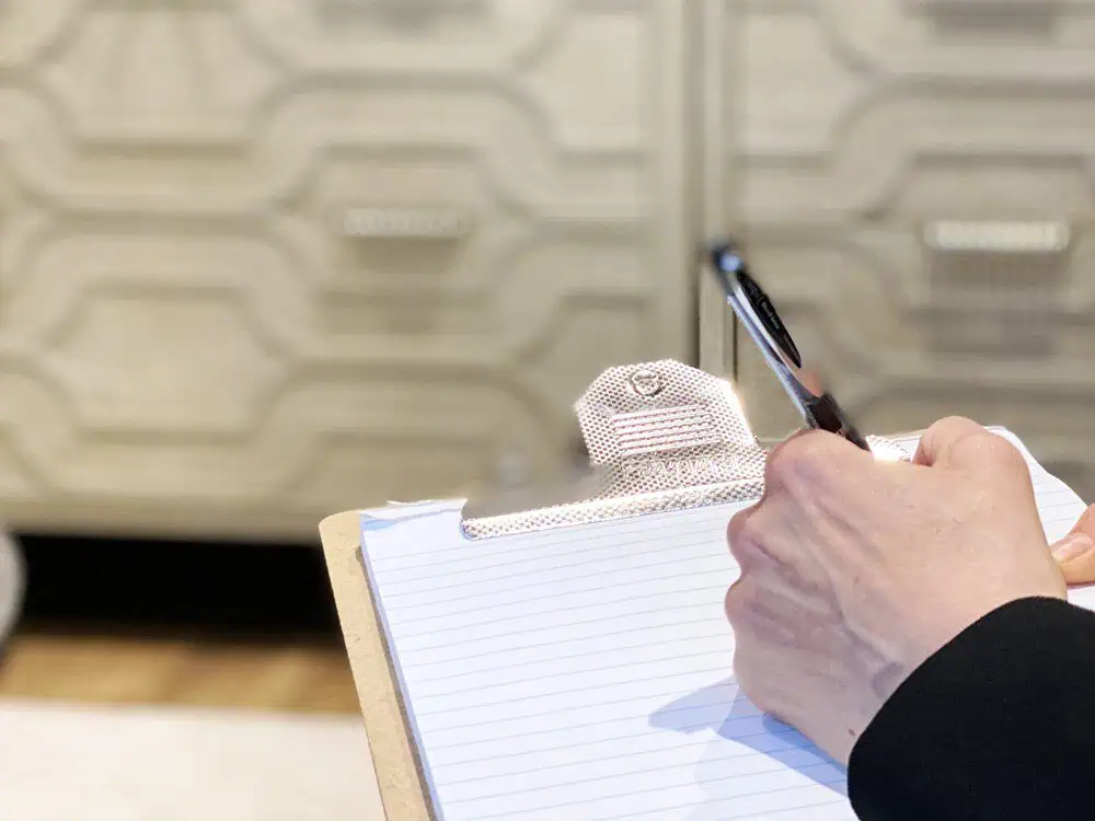 hand taking notes in a session