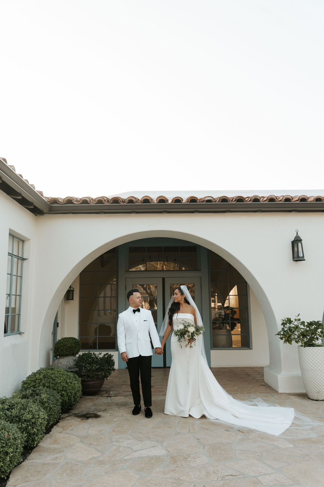 Bride and groom pose for golden hour romantics.