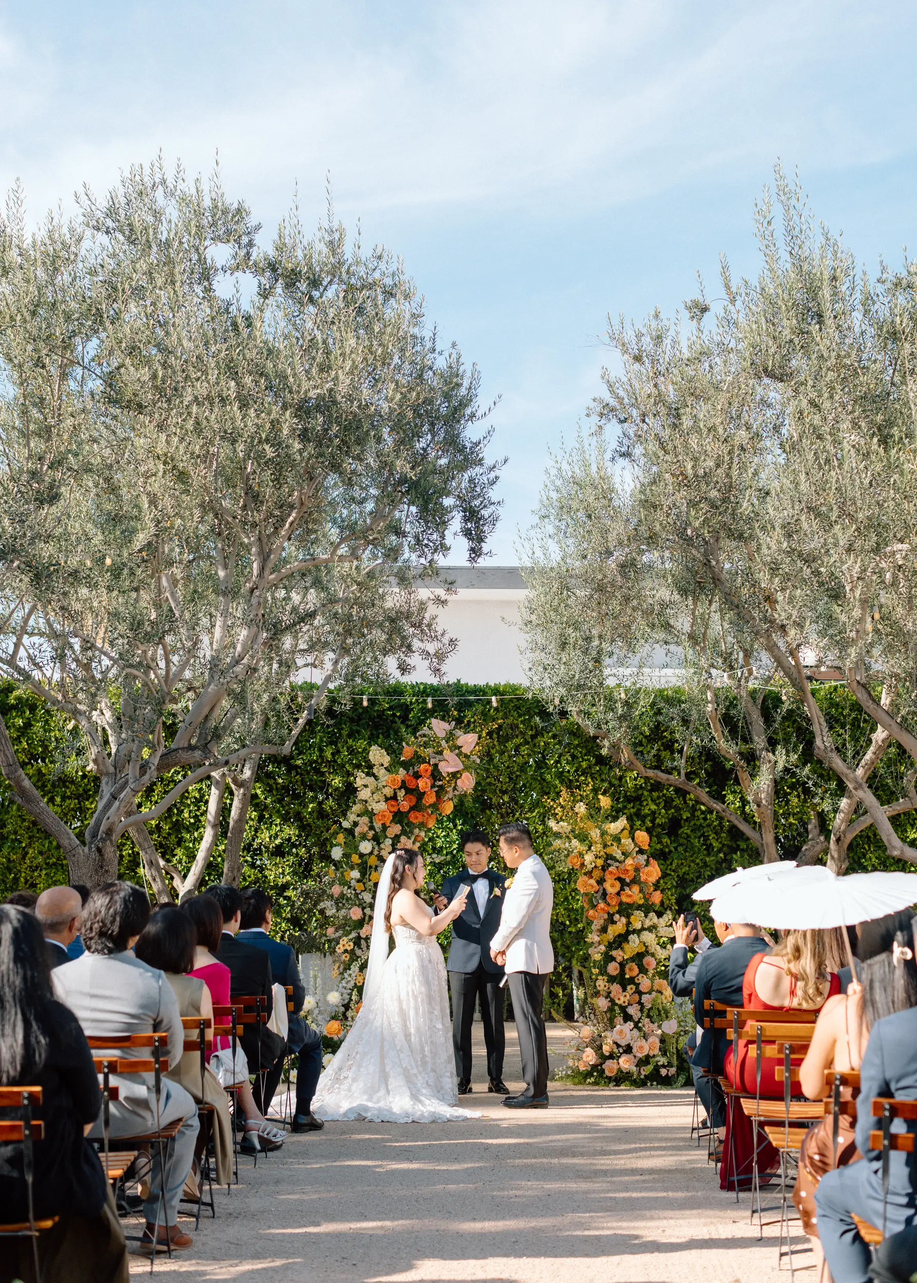Bride reads handwritten vows to groom.