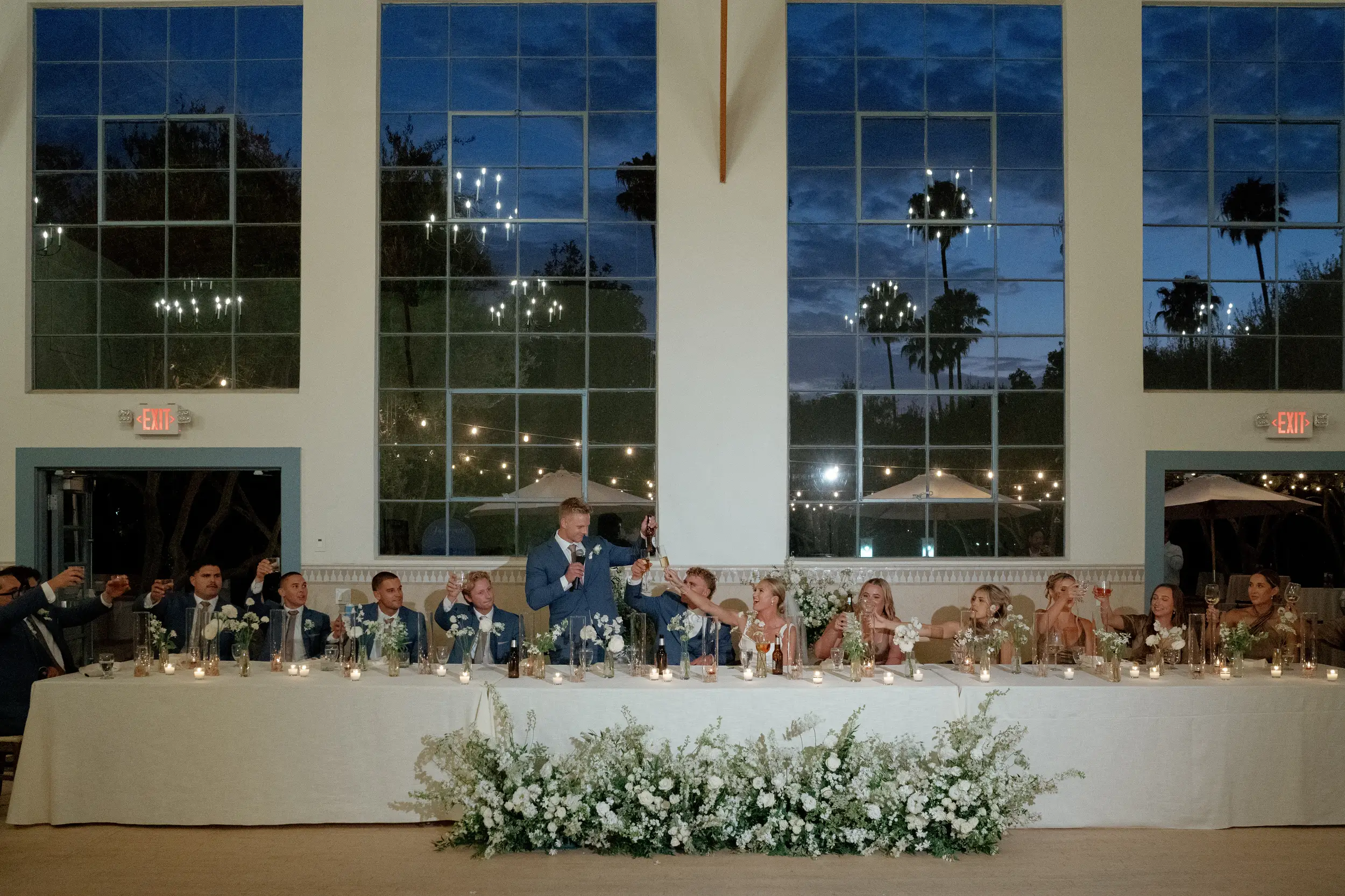 Head table toasts to the bride and groom.